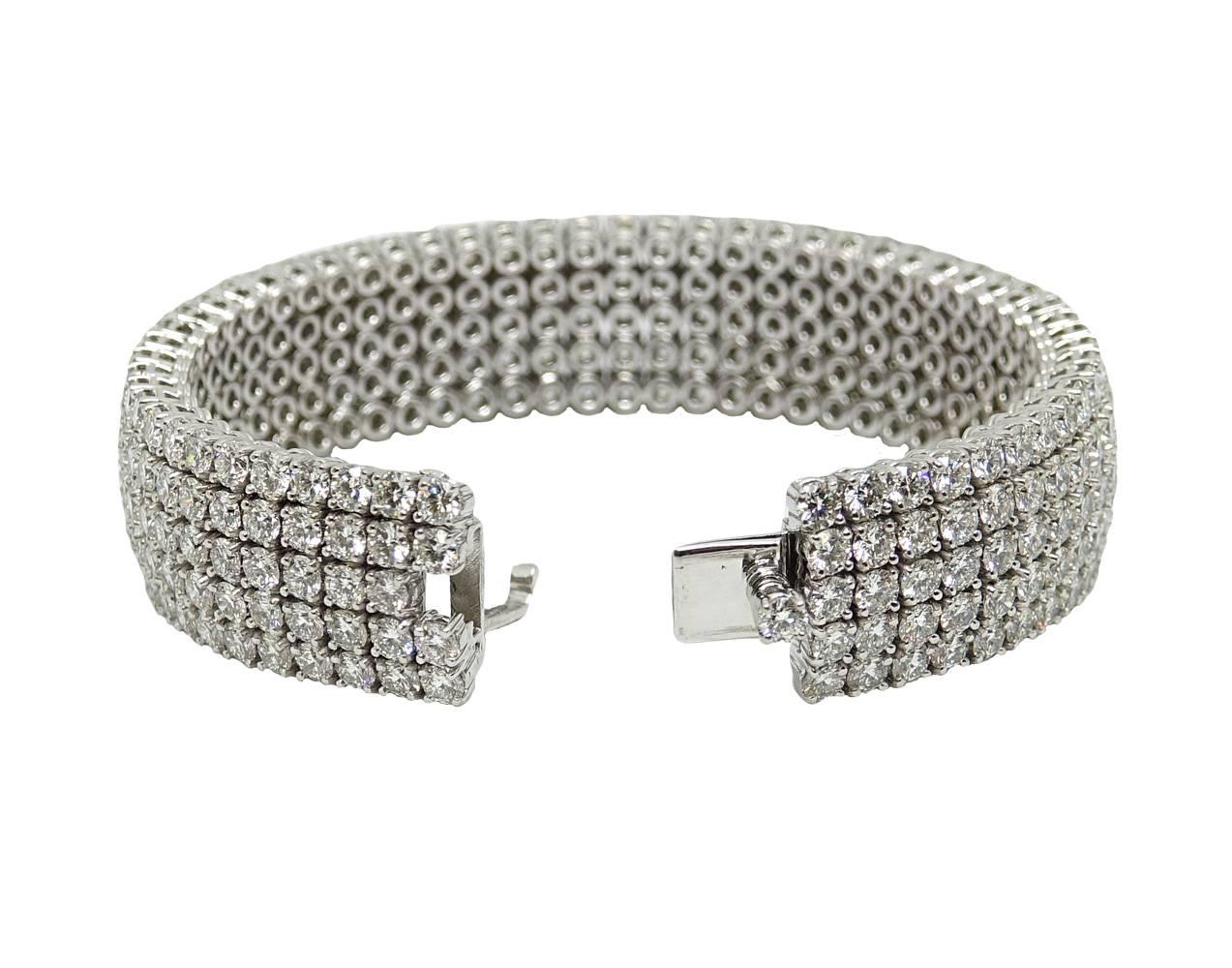 This Sparkling 18K White Gold Diamonds CUff Bracelet is 18K White Gold. 5 Rows Of Beautiful Round Diamonds Cover This Bracelet and Weigh A Total Carat Weight Of 32.55 Carats, H-I In Color and VS1-2 In Clarity. This Bracelet Is About 7 Inches Around.