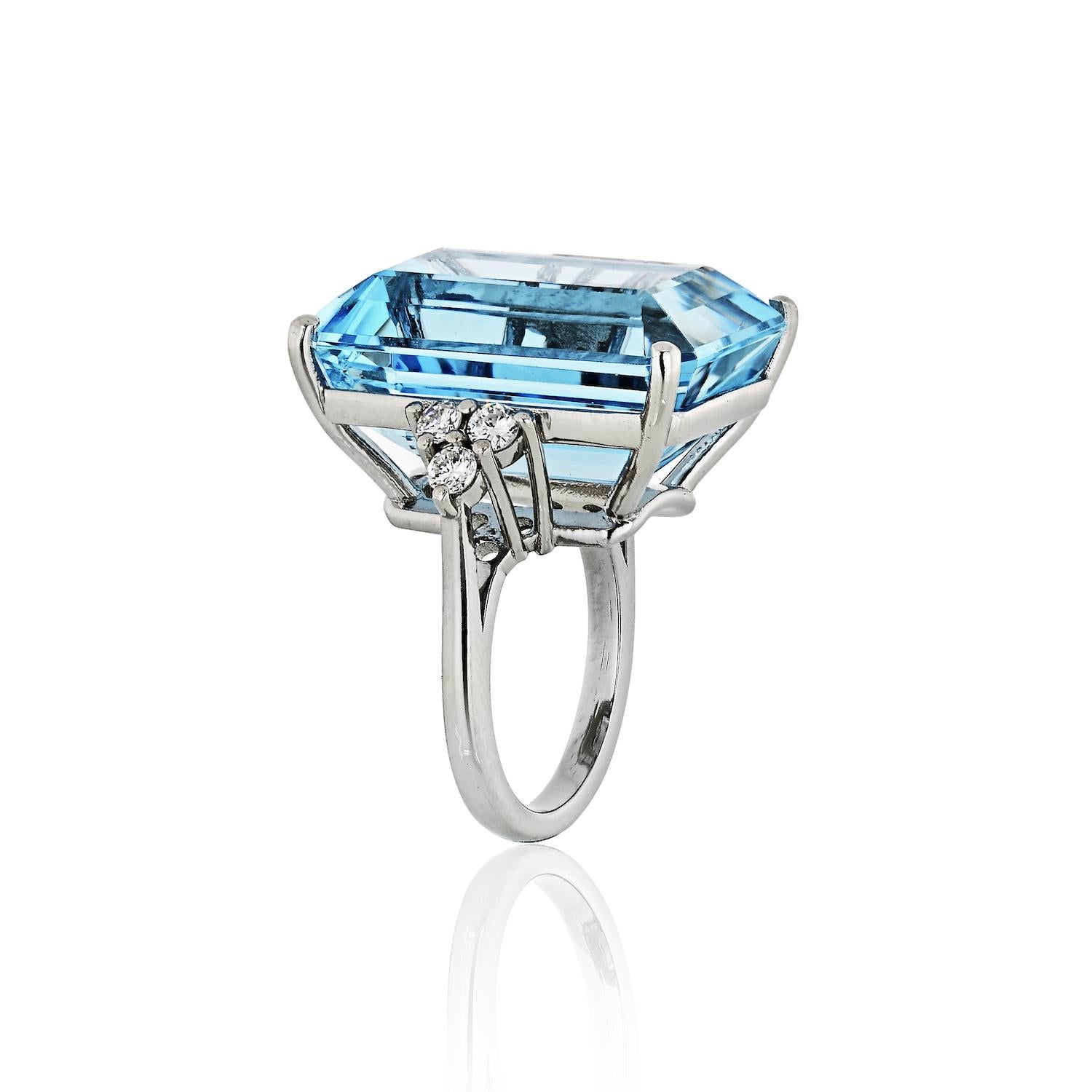 Questions? Call us anytime!
The Back Vault NYC.
833,998,2858

Centering a basket set emerald cut aquamarine weighing 32.55 carat that is transparent and a saturated naturally beautiful soft water color. Flanked by round brilliant cut diamonds