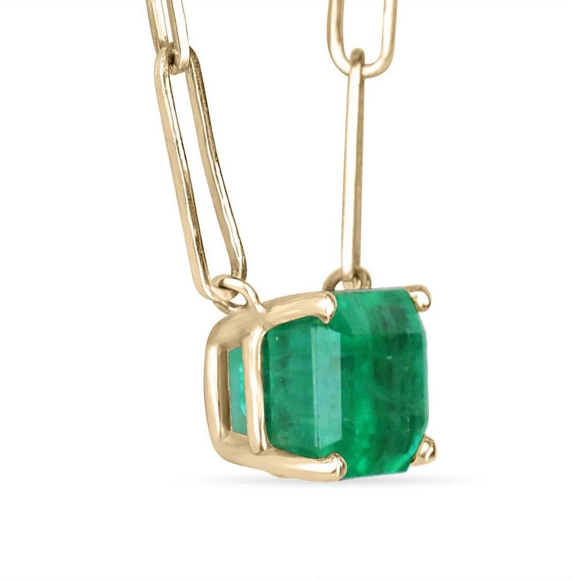 Featured here is a 3.25-carat stunning, East to West emerald necklace in 14K yellow gold. Displayed in the center is a dark green emerald with very good eye clarity, accented by a simple prong gold mount, allowing for the emerald to be shown in full
