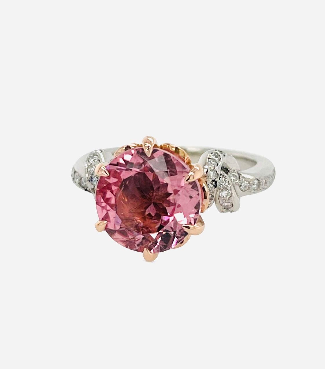 One of a kind 3.25ct Round Pink Tourmaline set in 18ct rose gold and platinum surrounded by FSI diamond band.


Made to order 
