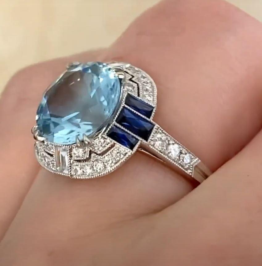 This exquisite geometric ring showcases a captivating approx. 3.20-carat aquamarine with exceptional saturation, reminiscent of the coveted Santa Maria hue. The aquamarine's vivid blue brilliance is beautifully complemented by a sleek platinum