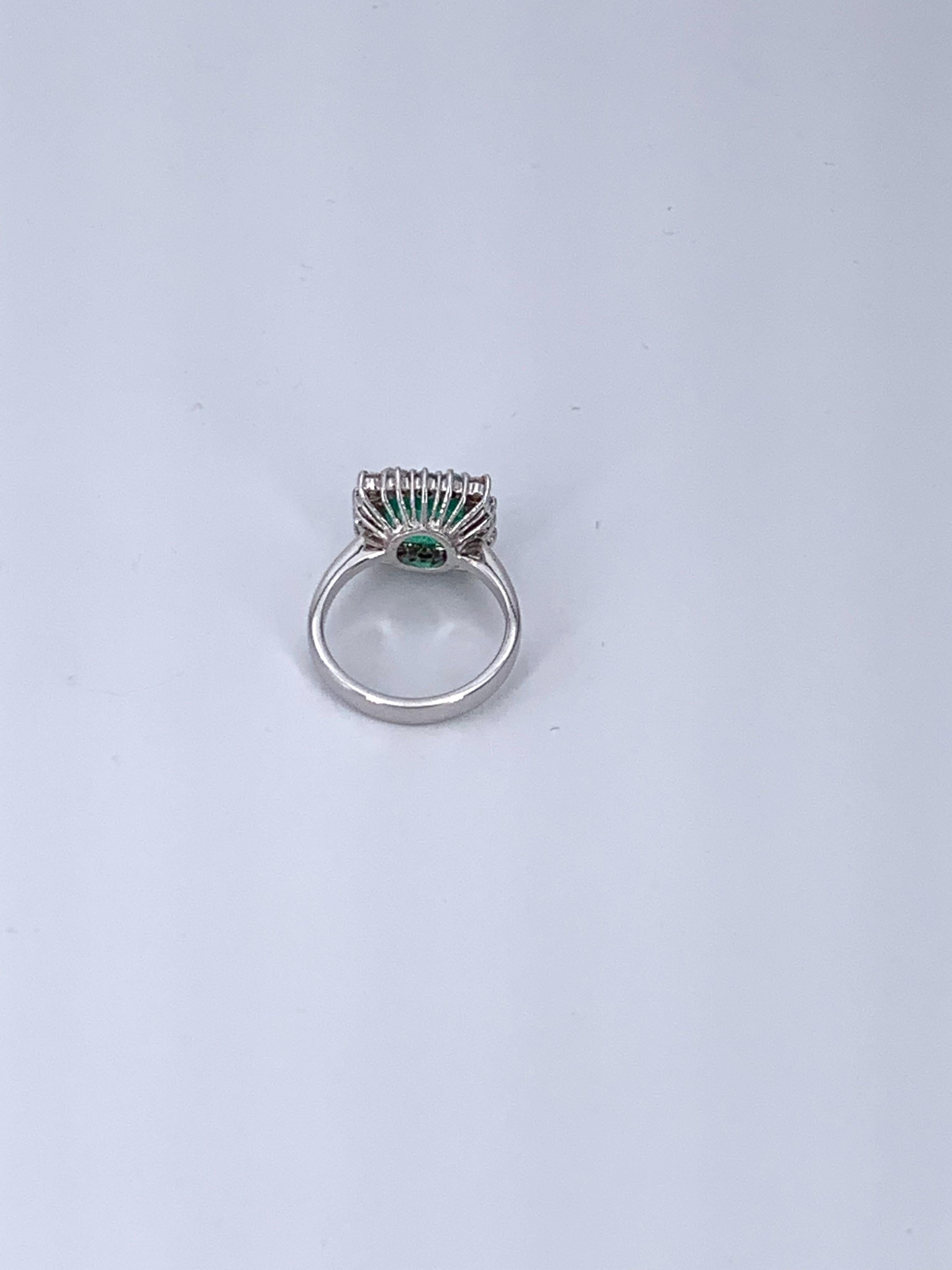Artisan 3.26 Carat Colombian Emerald and 1.02 Carat 18 Kt White Gold Halo Diamond Ring 