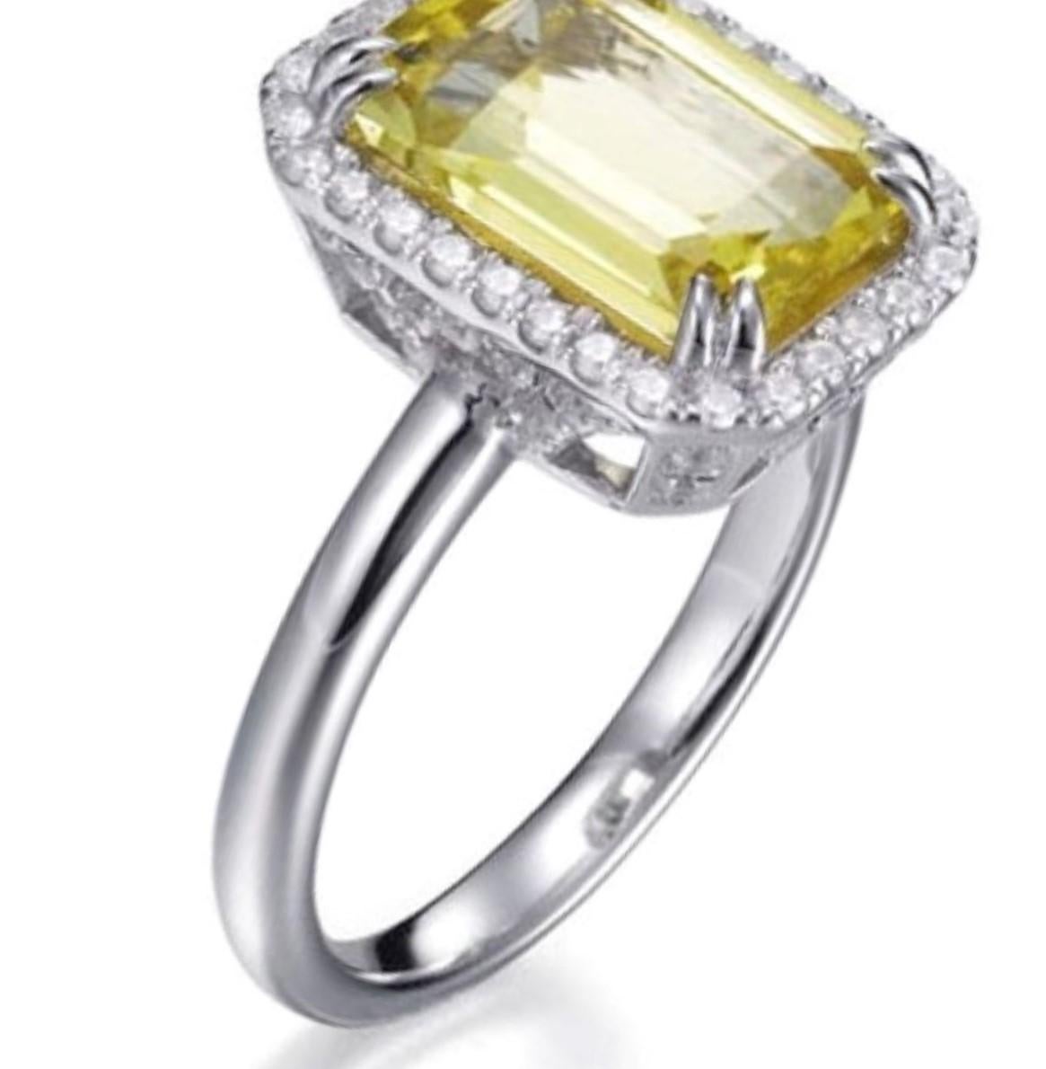 The timeless glamour of this Art Deco inspired ring ensures it will always bring a touch of elegance to any occasion. 

Featuring a 3.26 carat centre emerald cut citrine surround by approx 0.89 carat of round brilliant cut cubic zirconia. .