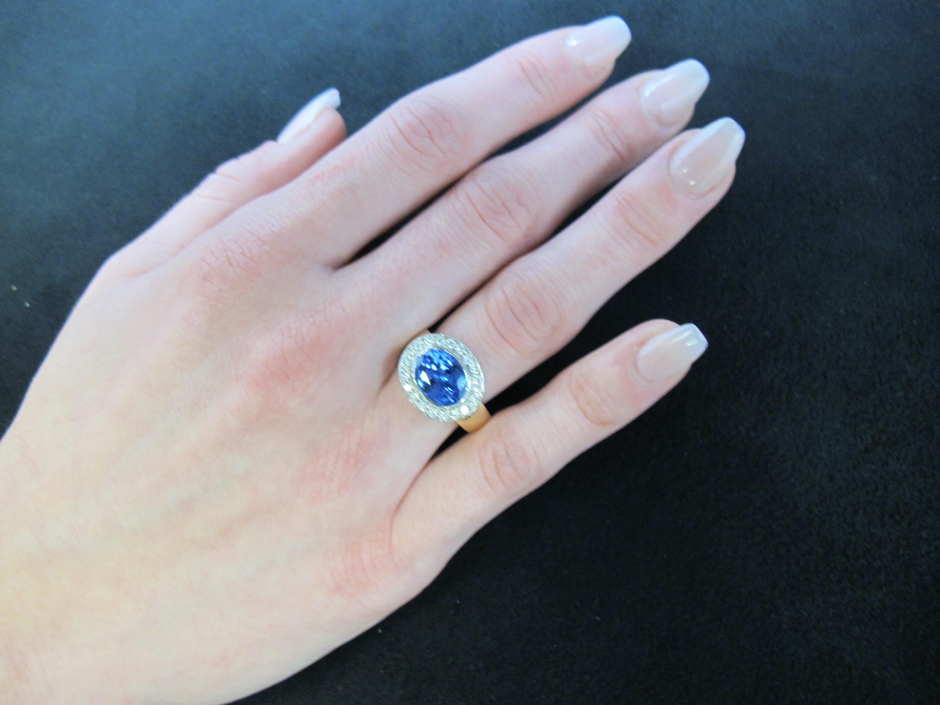 3.26 ct.Tanzanite, Diamond Halo, White Gold Bezel and Yellow Gold Band Ring 1