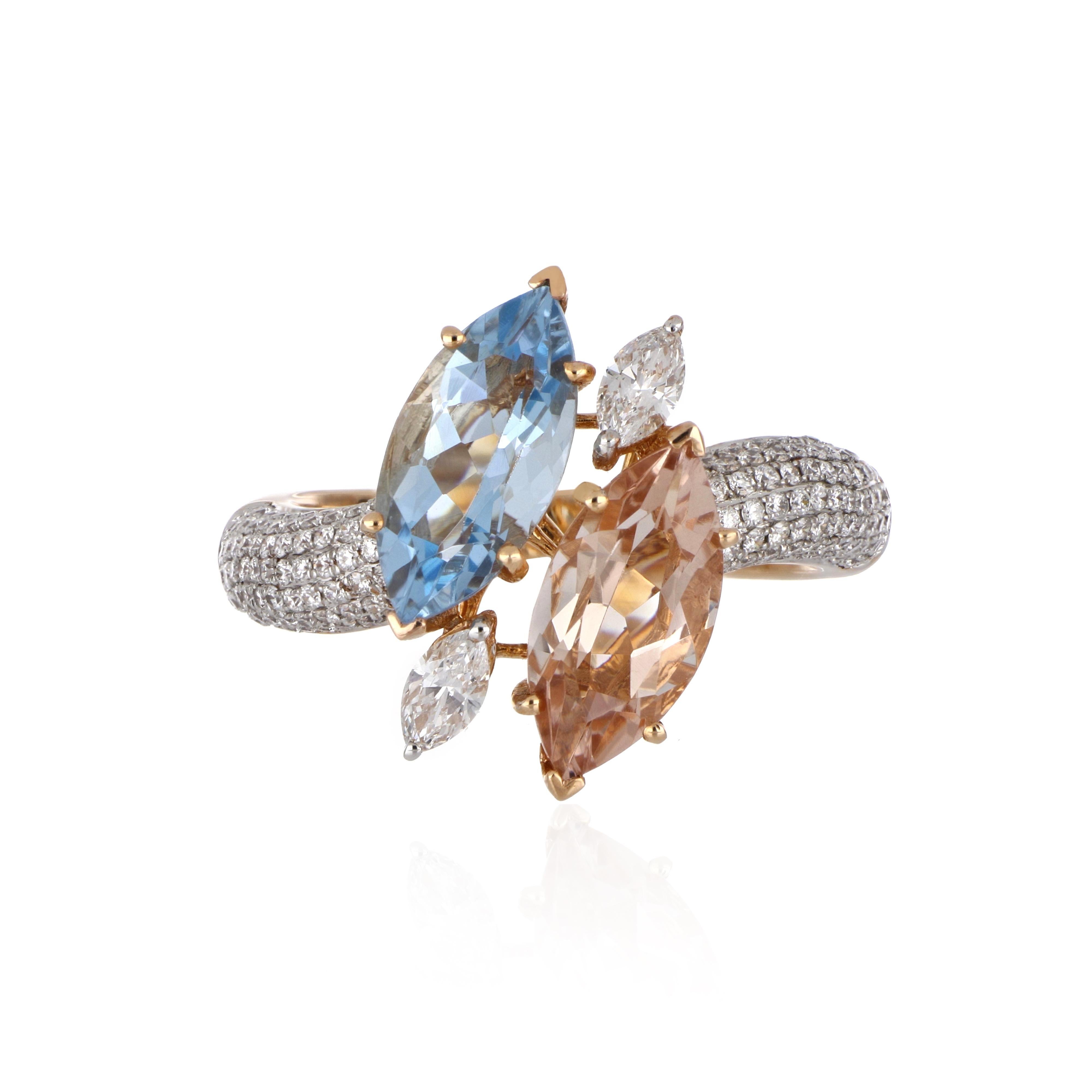 Elegant and exquisitely detailed Cocktail 18K Ring, centre set with 1.64 Ct Marquise Morganite and 1.62 Ct Marquise Aquamarine, surrounded by and enhanced on shank with micro pave Diamonds, weighing approx. 0.69 total carat weight. Beautifully Hand