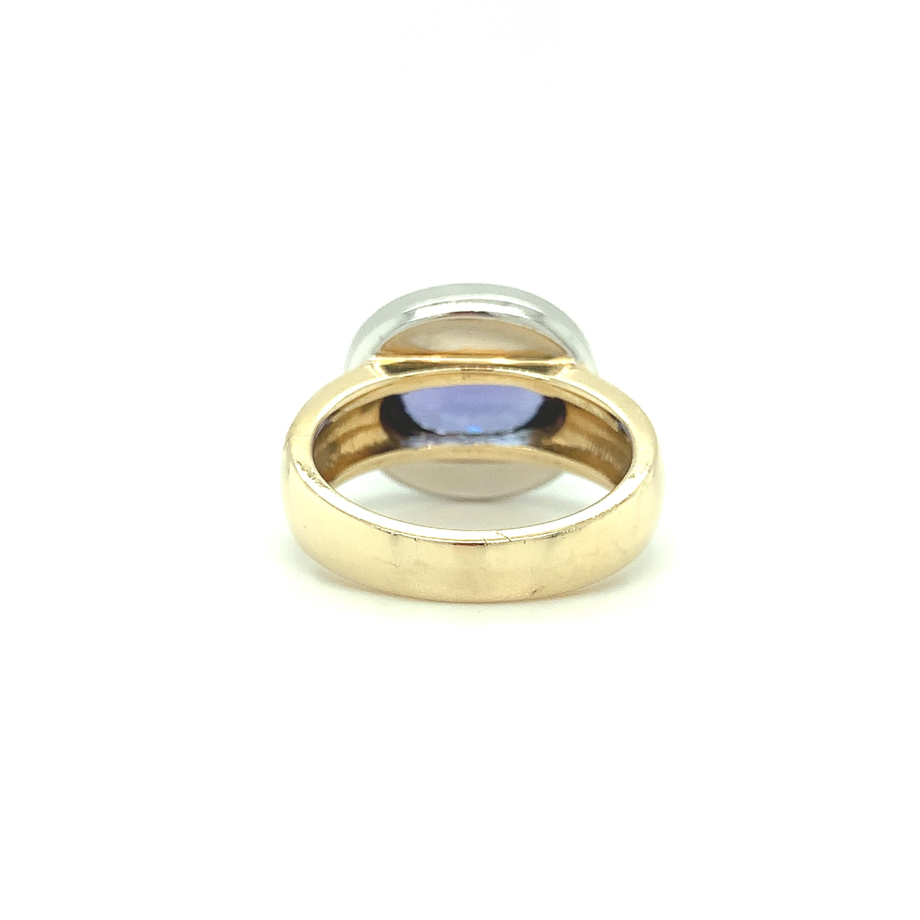 3.26 ct.Tanzanite, Diamond Halo, White Gold Bezel and Yellow Gold Band Ring In New Condition In Los Angeles, CA