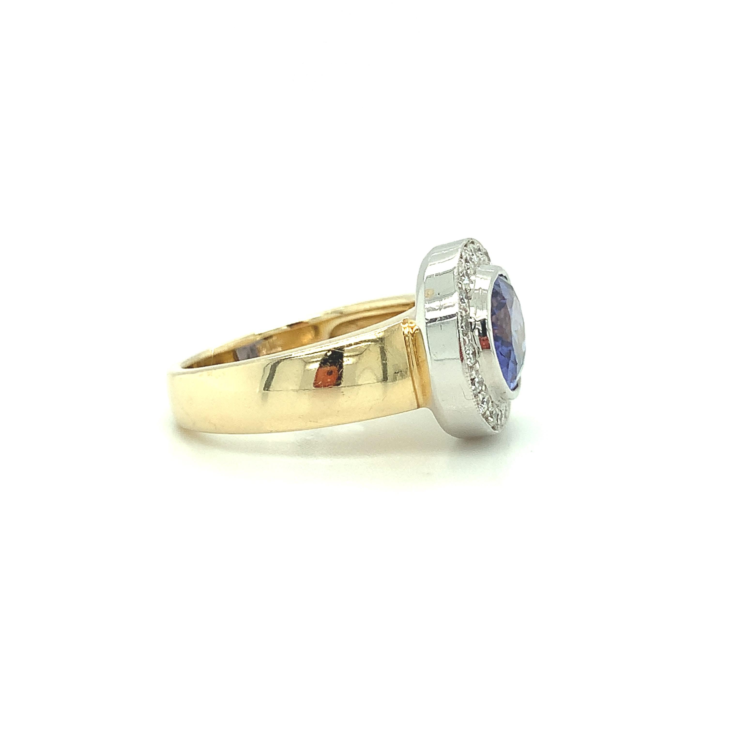 Oval Cut 3.26 ct.Tanzanite, Diamond Halo, White Gold Bezel and Yellow Gold Band Ring