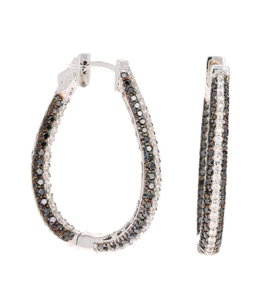 Gorgeous Oval Inside-Out Hoops with Black and White Diamonds!

There are 160 Round Cut Black Diamonds that weigh 2.18 Carats and 82 Round Cut White Diamonds that weigh 1.09 Carats. The total carat weight of the earrings are 3.27 Carats.  The Clarity