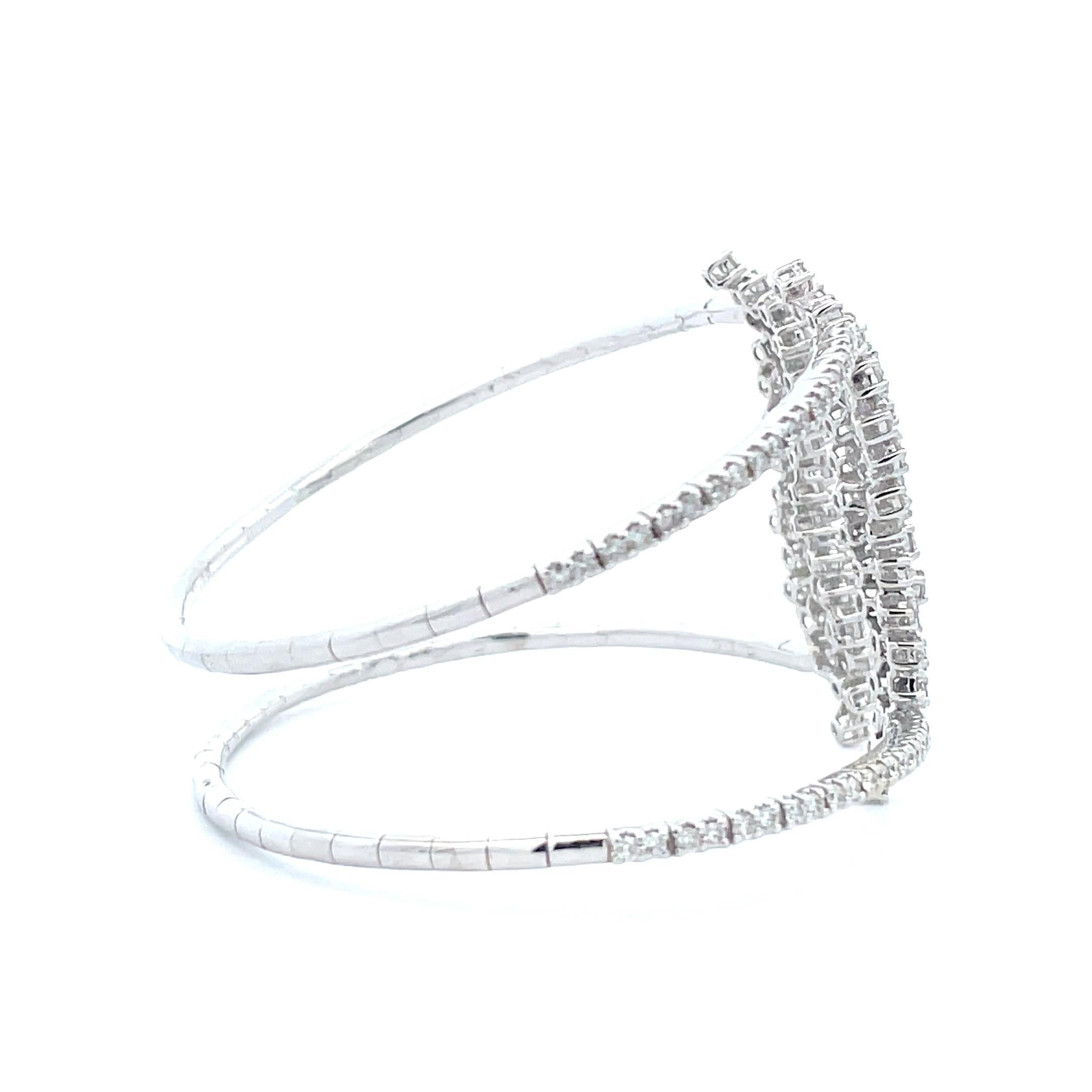 Discover the brilliance of the 3.27 ct. Diamond Cluster Double Band Cuff Bangle. Exquisite craftsmanship, unmatched quality and a classic design that exudes refined luxury are hallmarks of this exquisite design. The classic double- band cuff bangle
