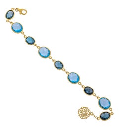 32.78 Carat Blue Topaz 18 Karat Yellow Gold Simple Bracelet