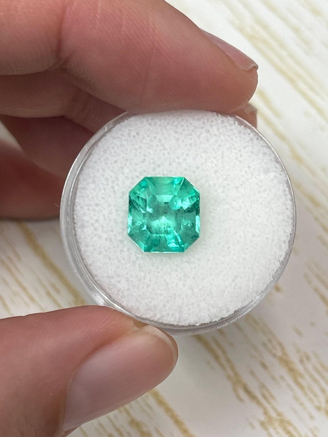 Stone: Emerald
Weight: 3.27-carats
Shape: Asscher Cut
Clarity: Transparent
Luster: Very Good
Color: Bluish Green
Measurements: 9.34mm x 8.78mm x 6.84mm
Geographic Origin: Colombia
Treatment: Natural, Oiling

Comments: Due to their growth conditions