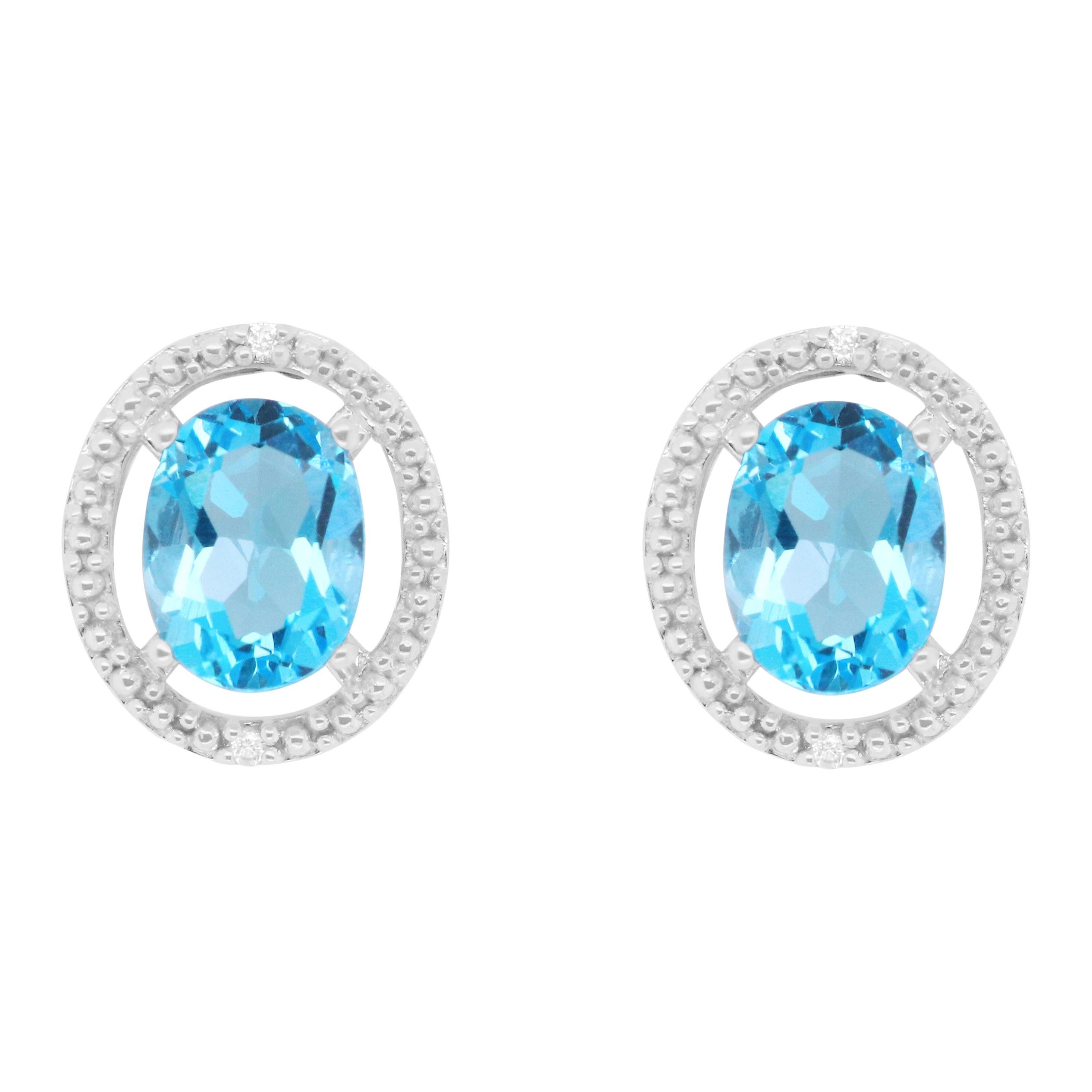 4.77 Carat Oval Blue Topaz Stud Earrings at 1stdibs