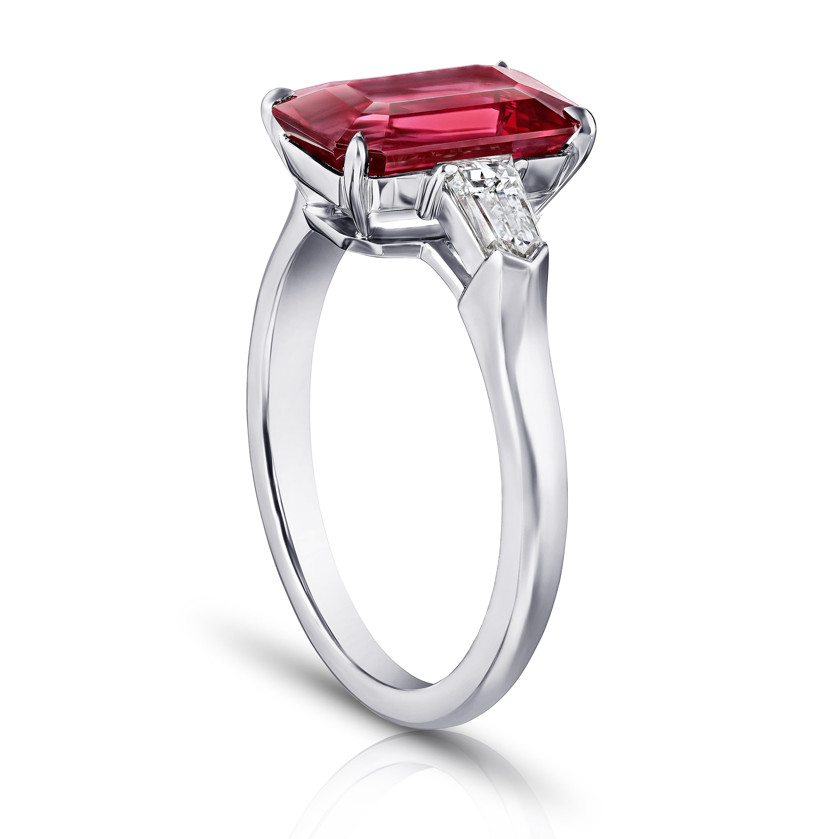 3.28 carat emerald cut red spinel with tapered bullet diamonds .50 carats set in a platinum ring. This ring is currently a size 7.  We will resize to your finger size without charge.
