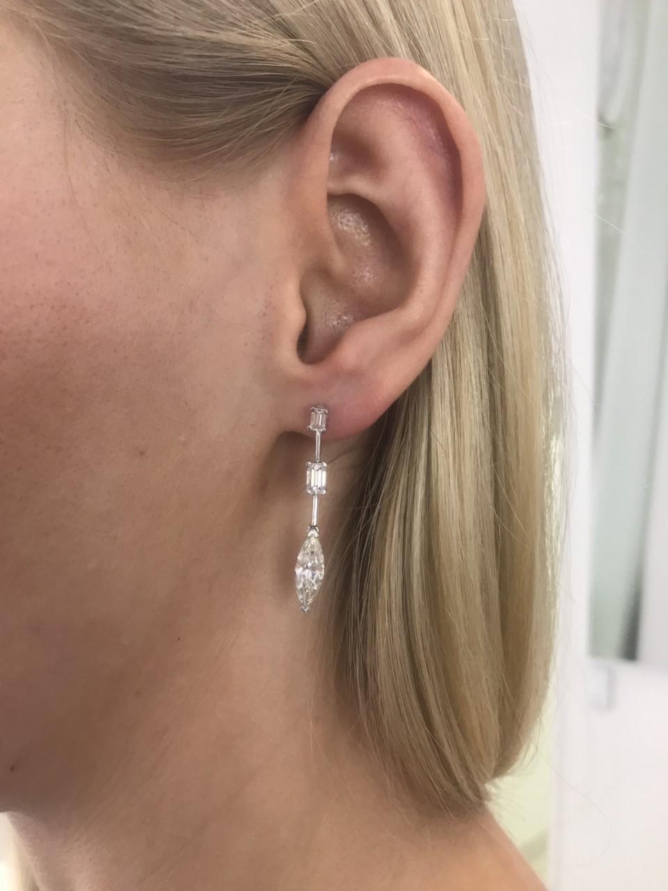 These stunning 2.31 Carat Marquise (2 stones) White Color H Clarity SI2 Diamond Earrings featuring 0.97 Carat Emerald Cut (4 stones) White Color H Clarity SI2 set in 18 Karat White Gold. A total Carat weight of 3.28 Carat these gorgeous dazzling