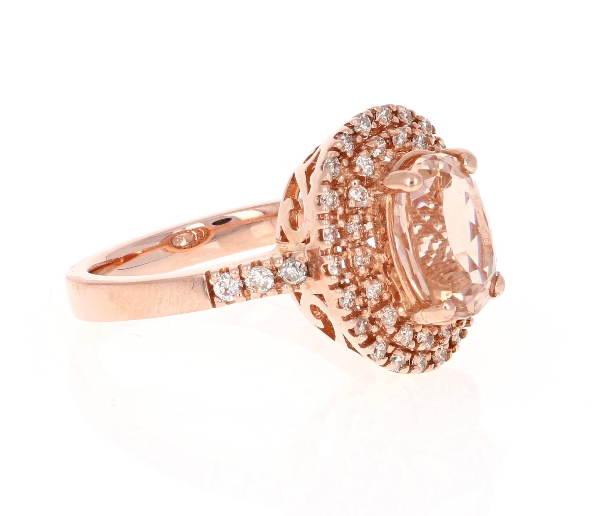 This ring is a 14K Rose Gold Ring which has a 2.76 carat Oval Cut Morganite in the center of the ring.  This ring is surrounded by a double halo of 46 Round Cut Diamonds that weigh a total of 0.52 carat.  The total carat weight of the ring is 3.28