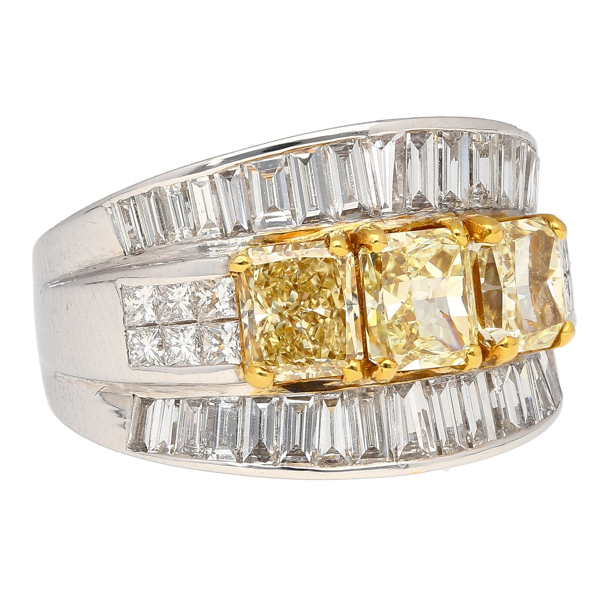 Presenting our Natural Diamond Cluster Ring, a true marvel of exquisite craftsmanship. This remarkable piece features three radiant-cut fancy yellow diamonds elegantly positioned side by side, complemented by two rows of princess-cut white diamonds