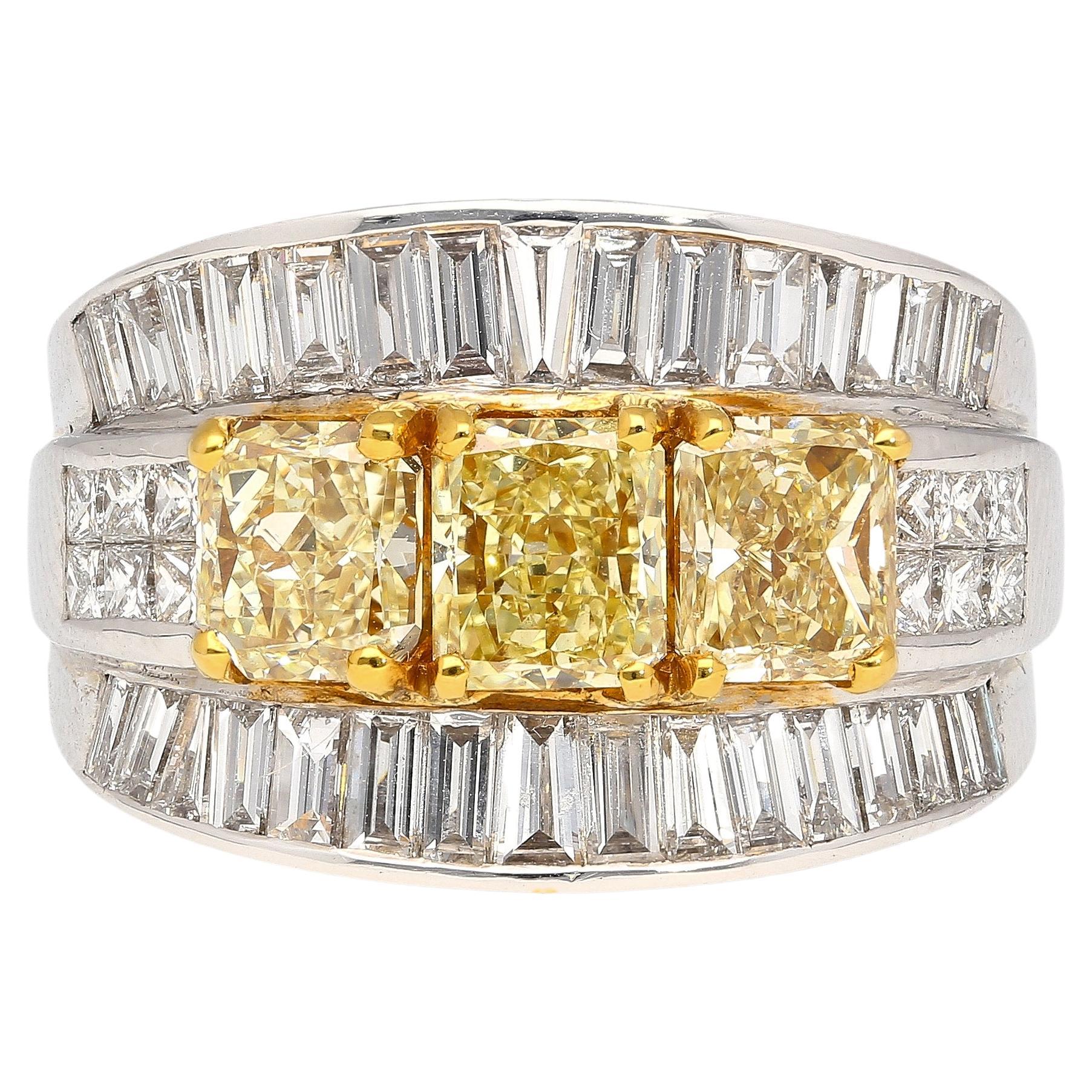 3.28 Carat Radiant Cut Fancy Yellow Diamond 3-Stone Ring in 18k White Gold For Sale