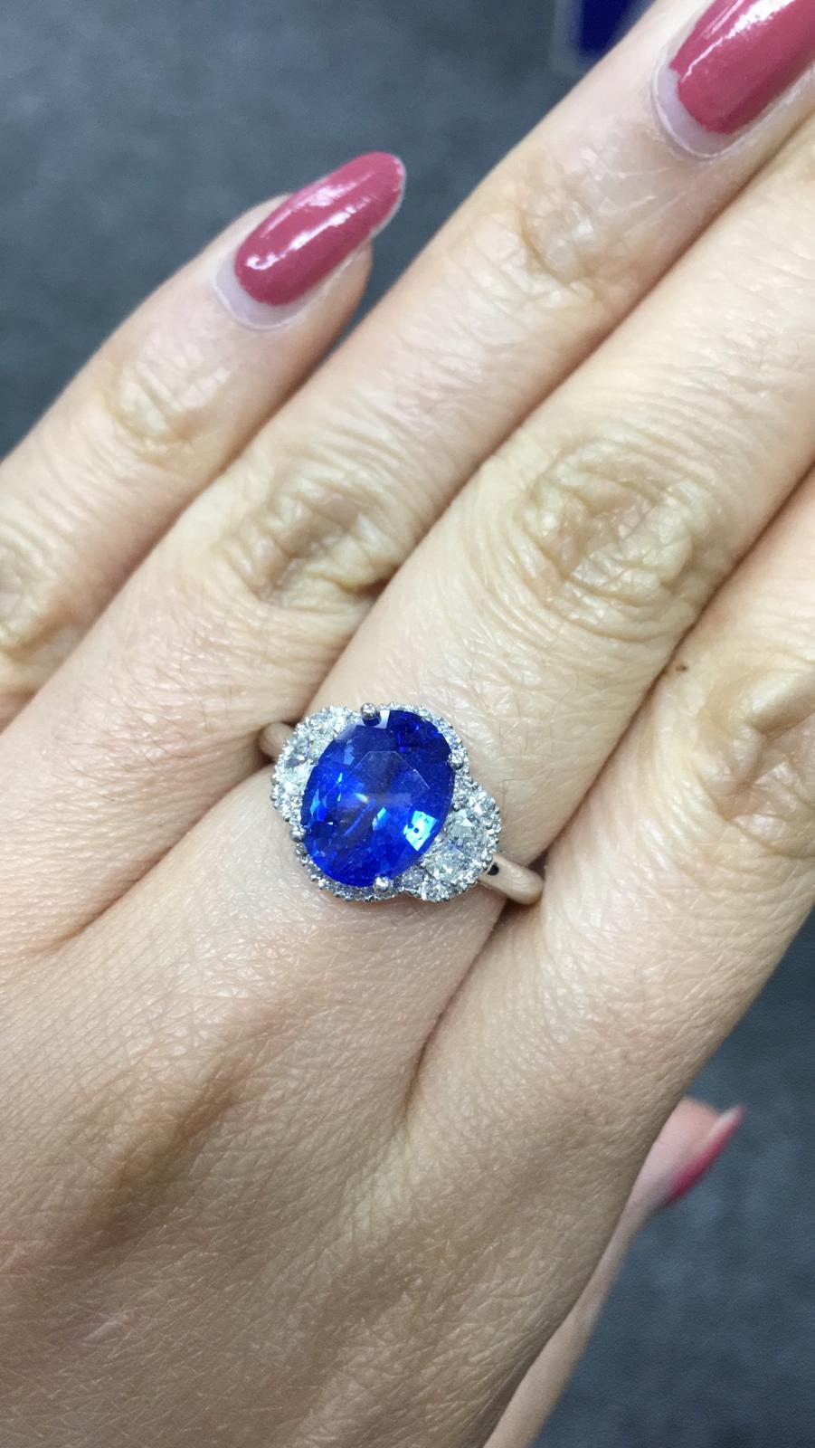 Primary Stone: Sapphire ( Sri Lanka )
Shape : Oval Cut
Sapphire Weight: 3.28 Carats (1 Sapphire)
Measurements Sapphire: 11.17 mm x 8.35 mm x 3.91 mm
Color: Vivid Blue
Accent Stones: Genuine Diamond
Shape Or Cut Diamond: 2 Pearl Brilliants & Numerous