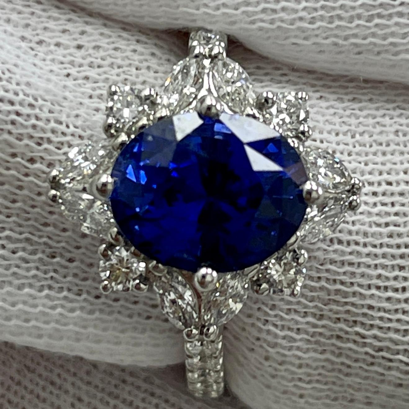 This is a BREATHTAKING sapphire with a very lively color, mounted in an elegant 18K white gold and diamond ring with 0.70carats of brilliant white diamonds. Suitable for any occasion!