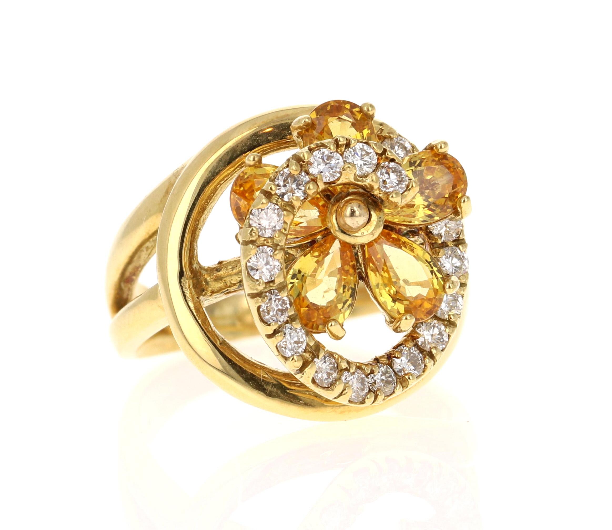 This ring has 5 Pear Cut Yellow Sapphires that weigh 2.74 Carats. It also has 18 Round Cut Diamonds that weigh 0.54 Carats. Clarity: VS and Color: H. The total carat weight of the ring is 3.28 Carats. 

The ring is beautifully set in 18K Yellow Gold