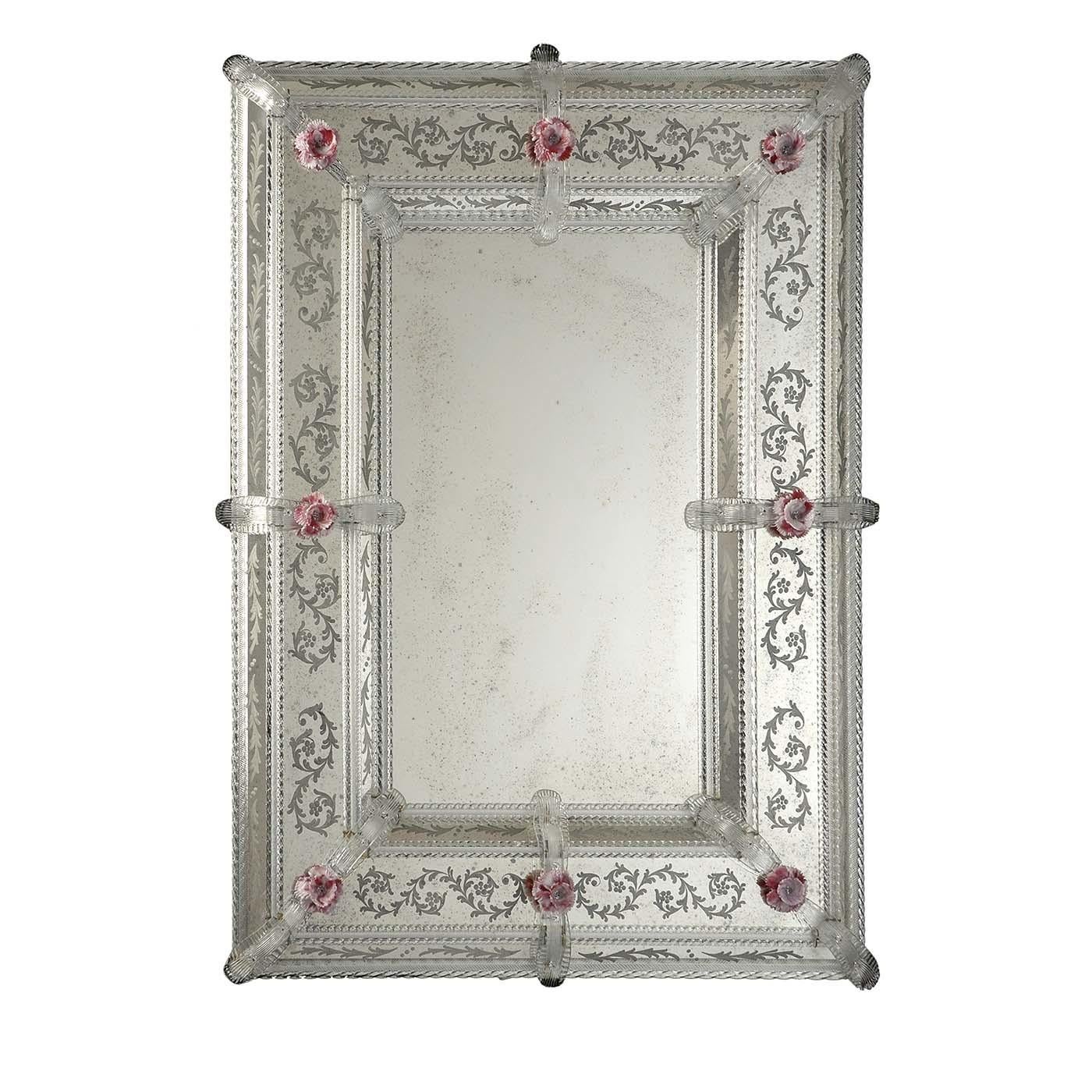 A magnificent example of Venetian artifact, the frame of this rectangular mirror was crafted of mouth-blown Murano glass and boasts three layers of decorations, all etched on the glass and featuring delicate floral motifs. The standout decoration of