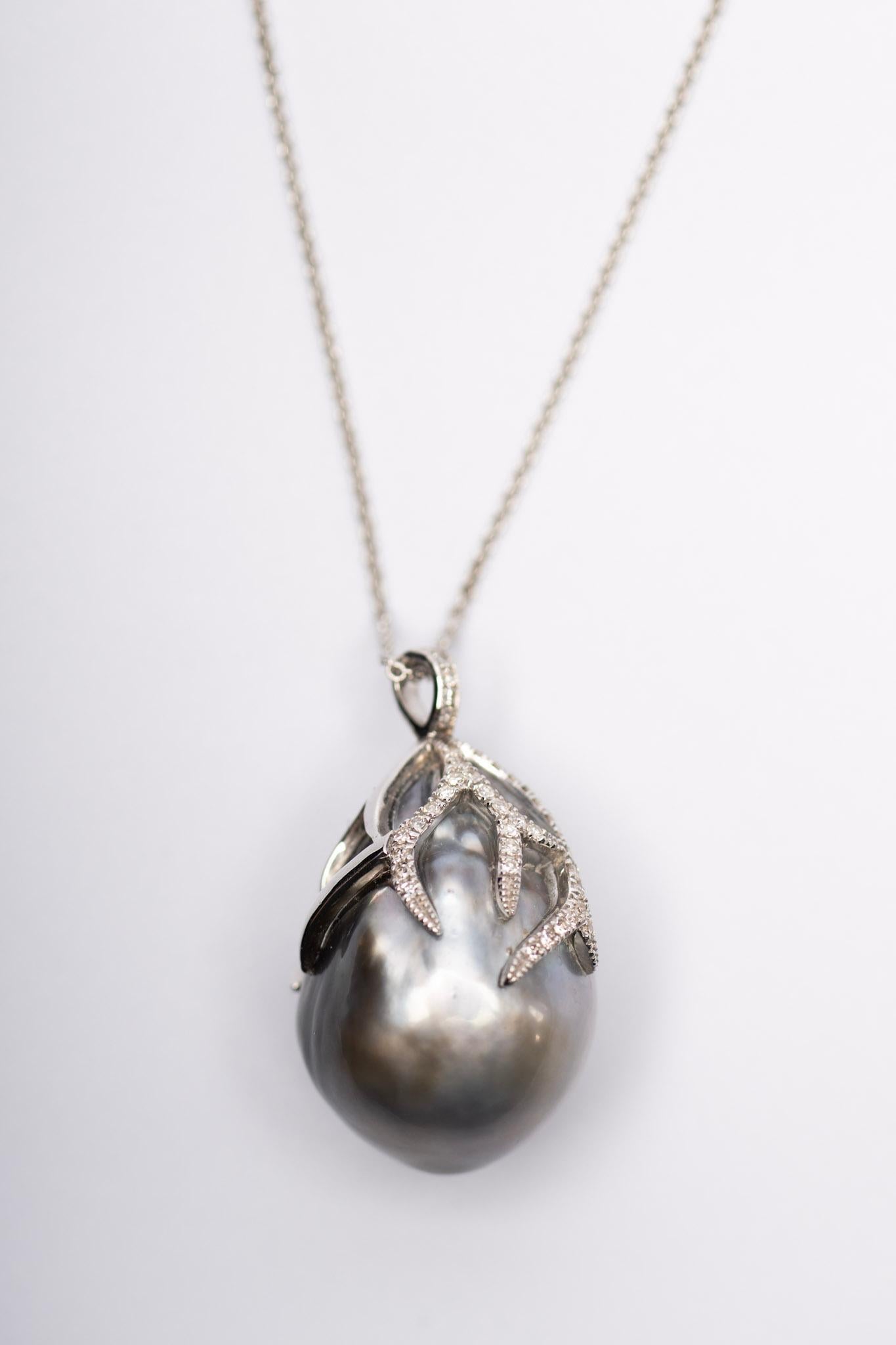 Isabelle is the definition of bold elegance. Featuring a magnificent, oversized Tahitian pearl cradled in diamond-dusted white gold claws, this one-of-a-kind necklace is both sculptural and soft—like nature forged it just for you. The organic curves
