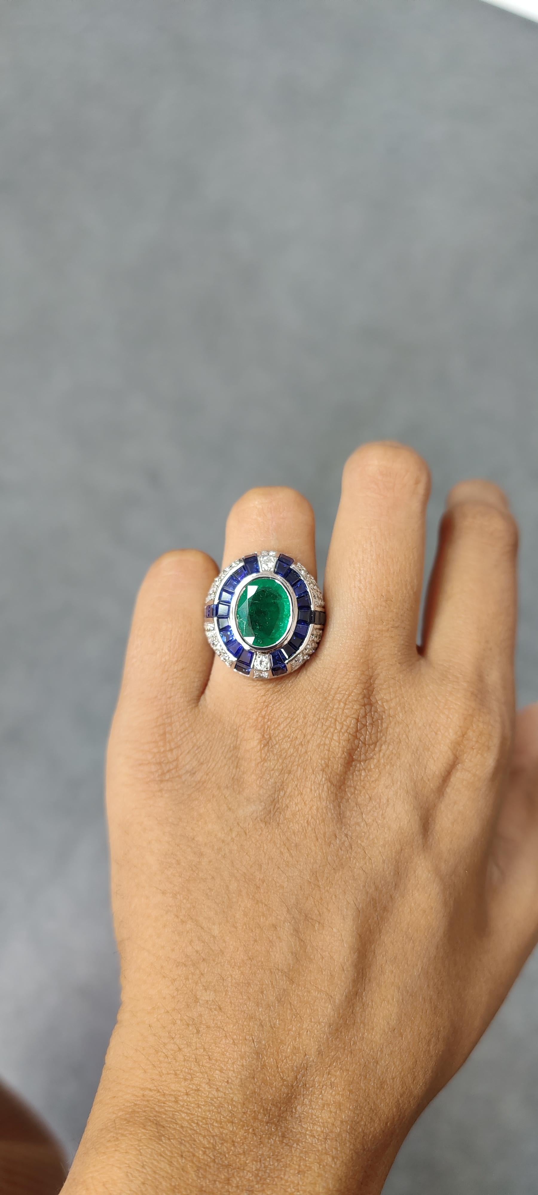 Introducing the epitome of luxury and sophistication, behold this breathtaking Art Deco inspired, Emerald Statement Ring, a true marvel in the world of fine jewelry. Crafted with precision and passion, this extravagant piece exudes opulence from