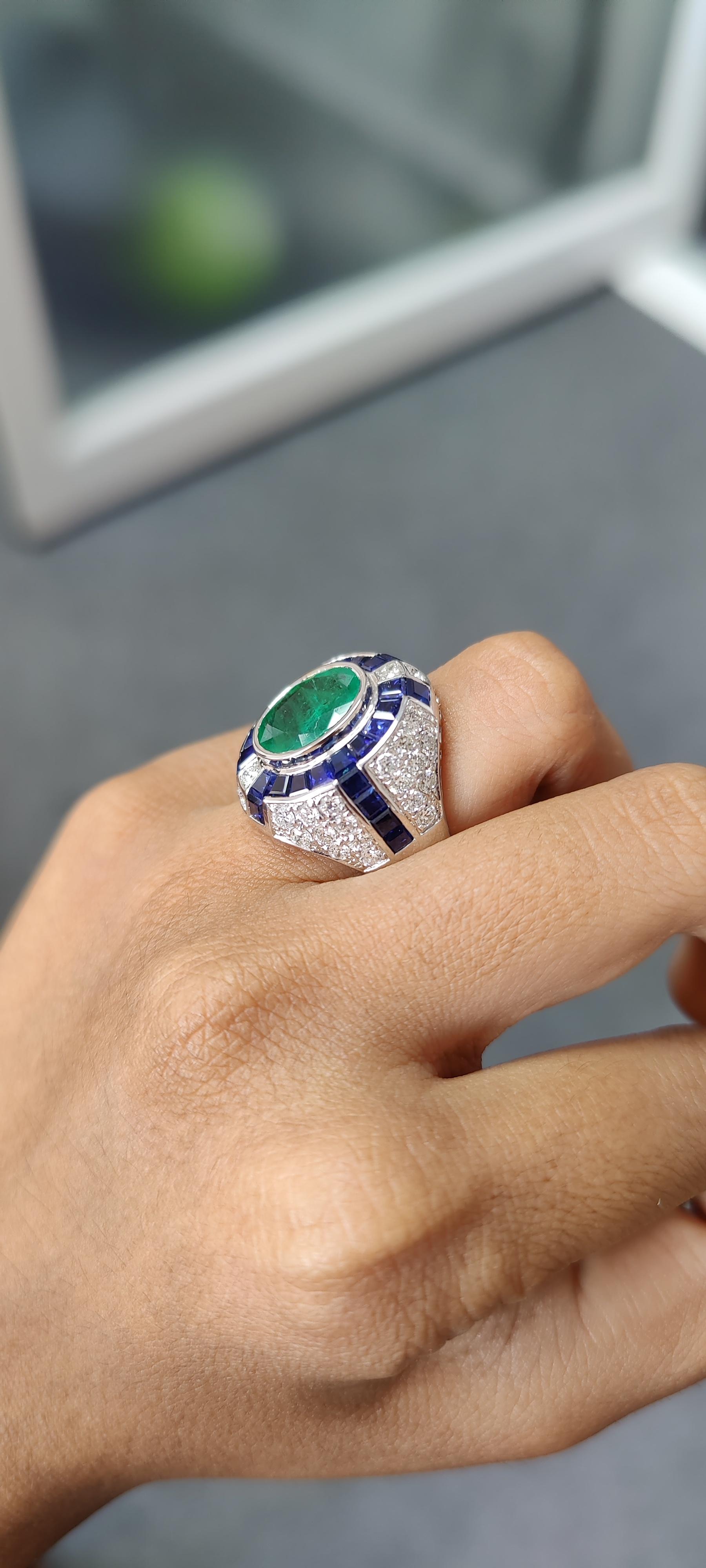 3.29 Carat Art Deco Emerald Ring studded with Blue Sapphires & Diamonds For Sale 1