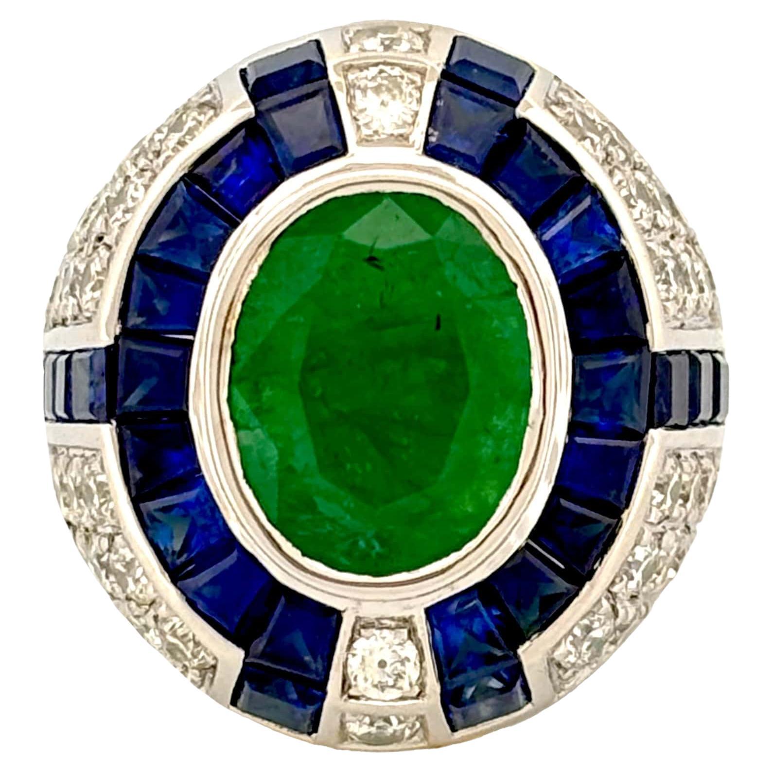 3.29 Carat Art Deco Emerald Ring studded with Blue Sapphires & Diamonds For Sale