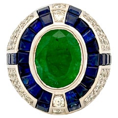 3.29 Carat Art Deco Emerald Ring studded with Blue Sapphires & Diamonds