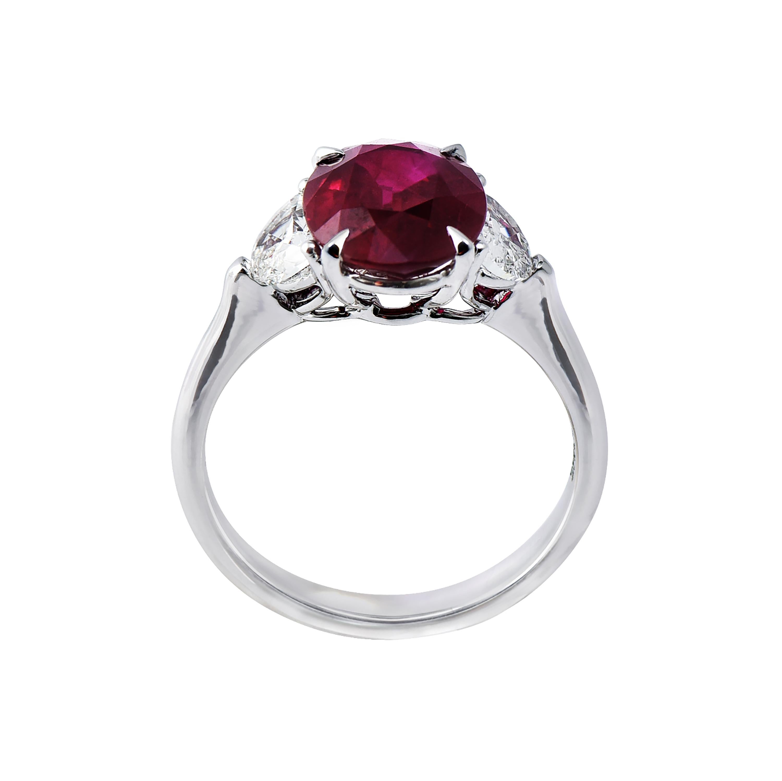 18 karat white gold ruby ring from the Scarlet collection of Laviere. The ring is set with a GRS certified 3.29 carats oval shape Burmese ruby and two half moon cut diamonds totaling 0.71 carats. 
Gold Weight 4.25 grams. Diamond Clarity VS-SI.