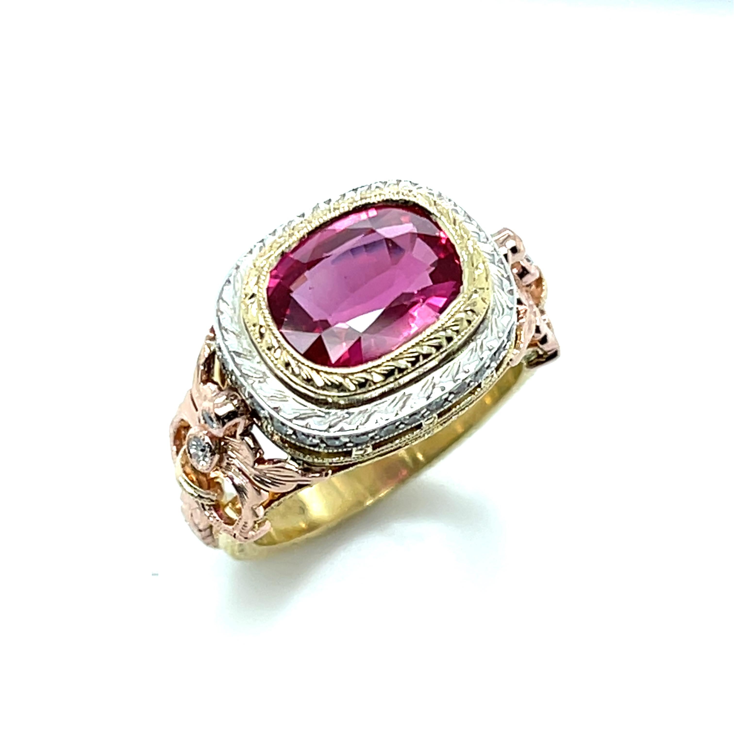 This exquisite handmade ring features a stunning 3.29 carat vibrant, hot pink sapphire set with diamonds in 18k gold. The sapphire is a cushion shape with rich, saturated color and exceptional clarity. It is set 