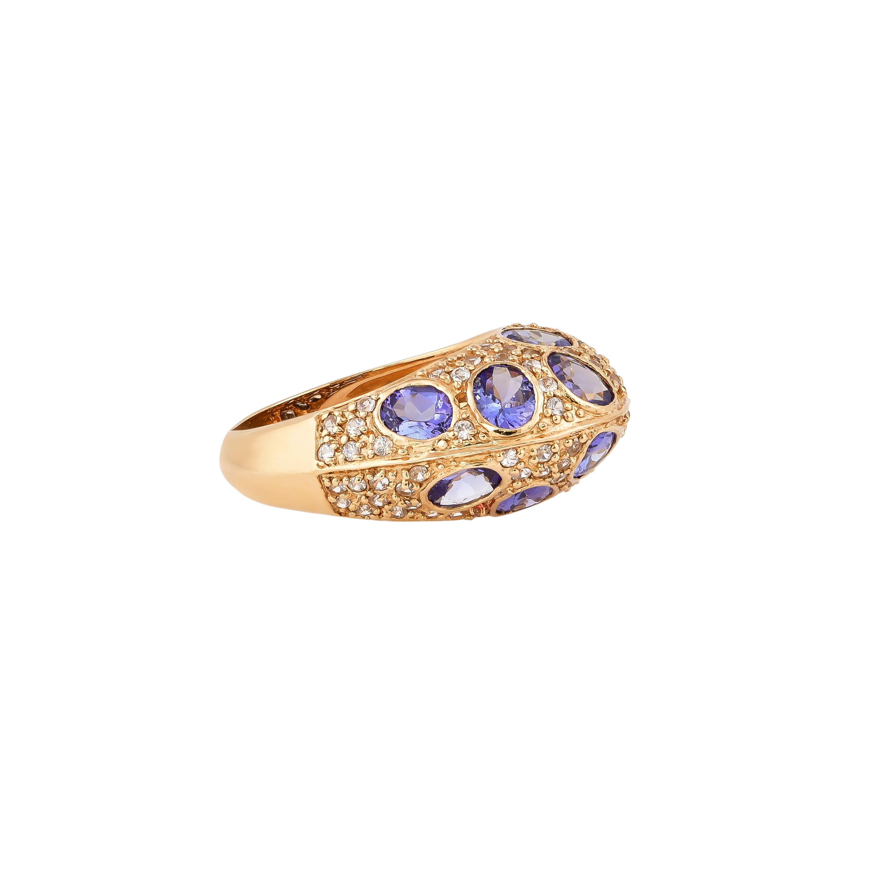 Glamorous Gemstones - Sunita Nahata started off her career as a gemstone trader, and this particular collection reflects her love for multi-colored semi-precious gemstones. This ring presents a cluster of tanzanites accented with pave white