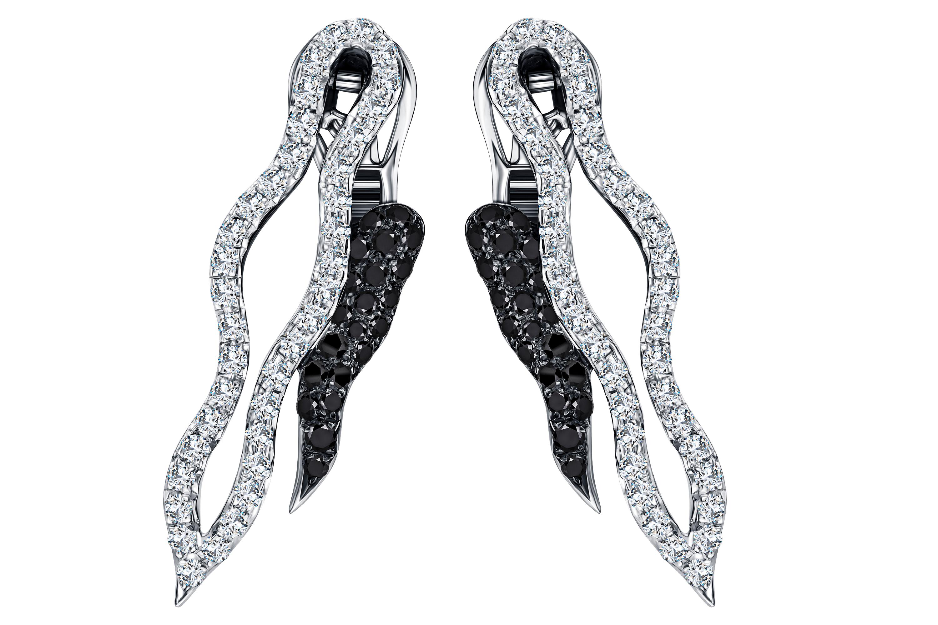 These stunning 18 Karat White Gold earrings feature 2.12 Carats of Round Brilliant White Diamonds F/G -VS1 and 1.17 Carats of Round Brilliant Black Diamonds. British Hallmark by The London Assay Office, certified by the IGR.
There is a matching