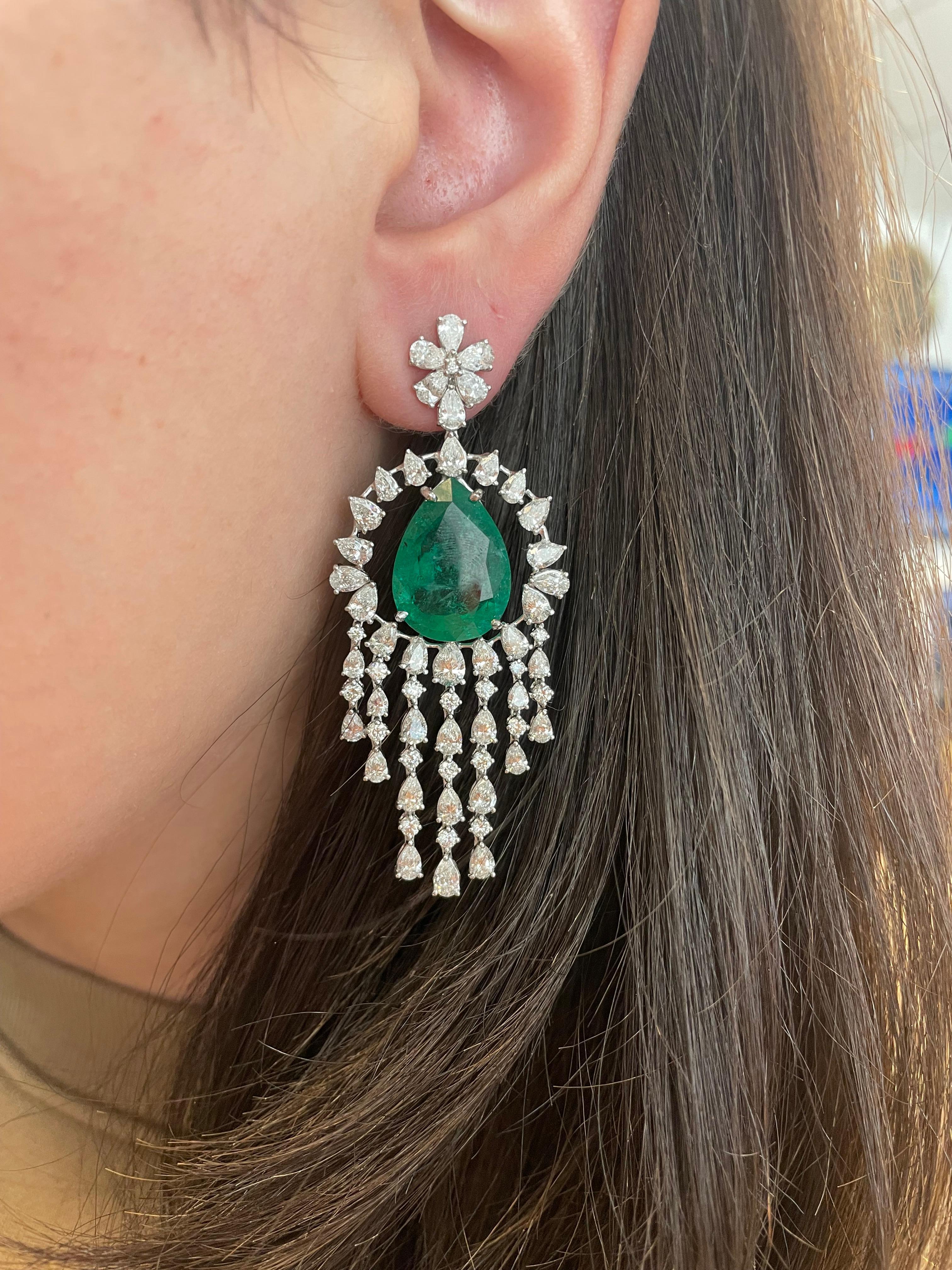 Stunning emerald and diamond chandelier earrings.. High jewelry by Alexander Beverly Hills.
2 pear emeralds, 21.05 carats, apx F2. Complimented by 124 pear and round cut diamonds, 11.87 carats. Approximately G/H color and VS2/SI1 clarity. 18-karat