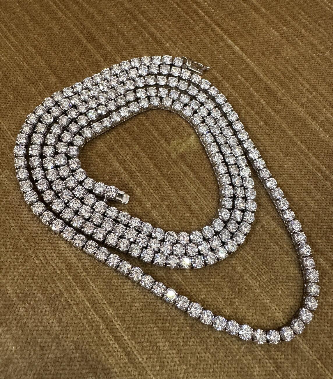 Long Luxurious Diamond In-line Riviera Necklace features 
229 Round Brilliant Cut Diamonds set in four-prong setting.
Necklace is 18k White Gold with a Total Weight of 32.96 carats.
Necklace is 31.5 inches long and weighs 44.6 grams.
Hallmarks: 750,