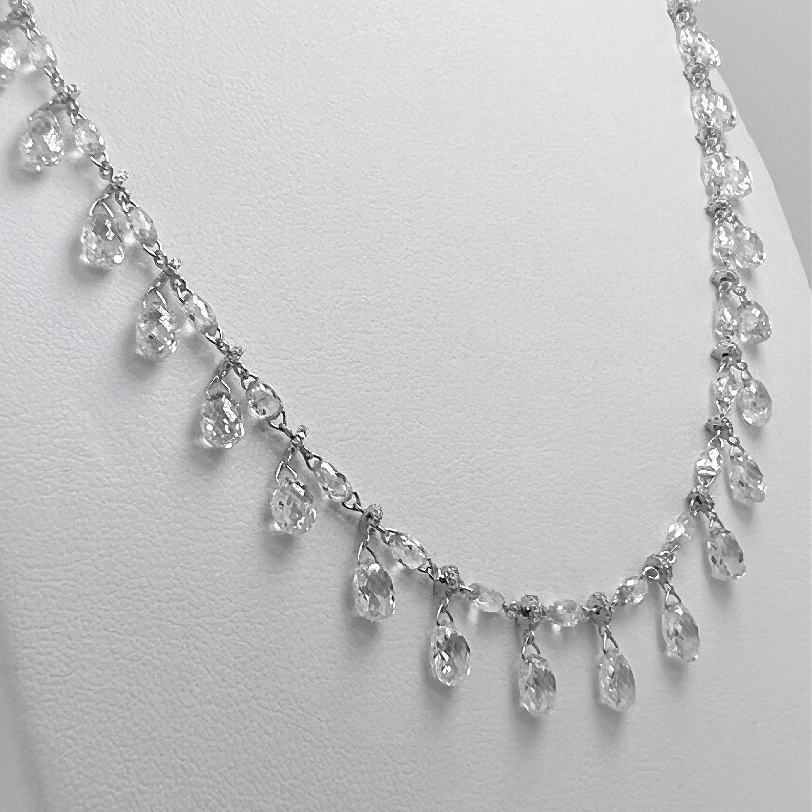 This is a stunning 1920 inspired Dangling Briolette Diamond Necklace weighing 32.98 carats in total.  This remarkable piece features 517 pieces of Briolette cut and Round Brilliant cut diamonds set on 18 Karat White Gold. 

Diamond: 32.98