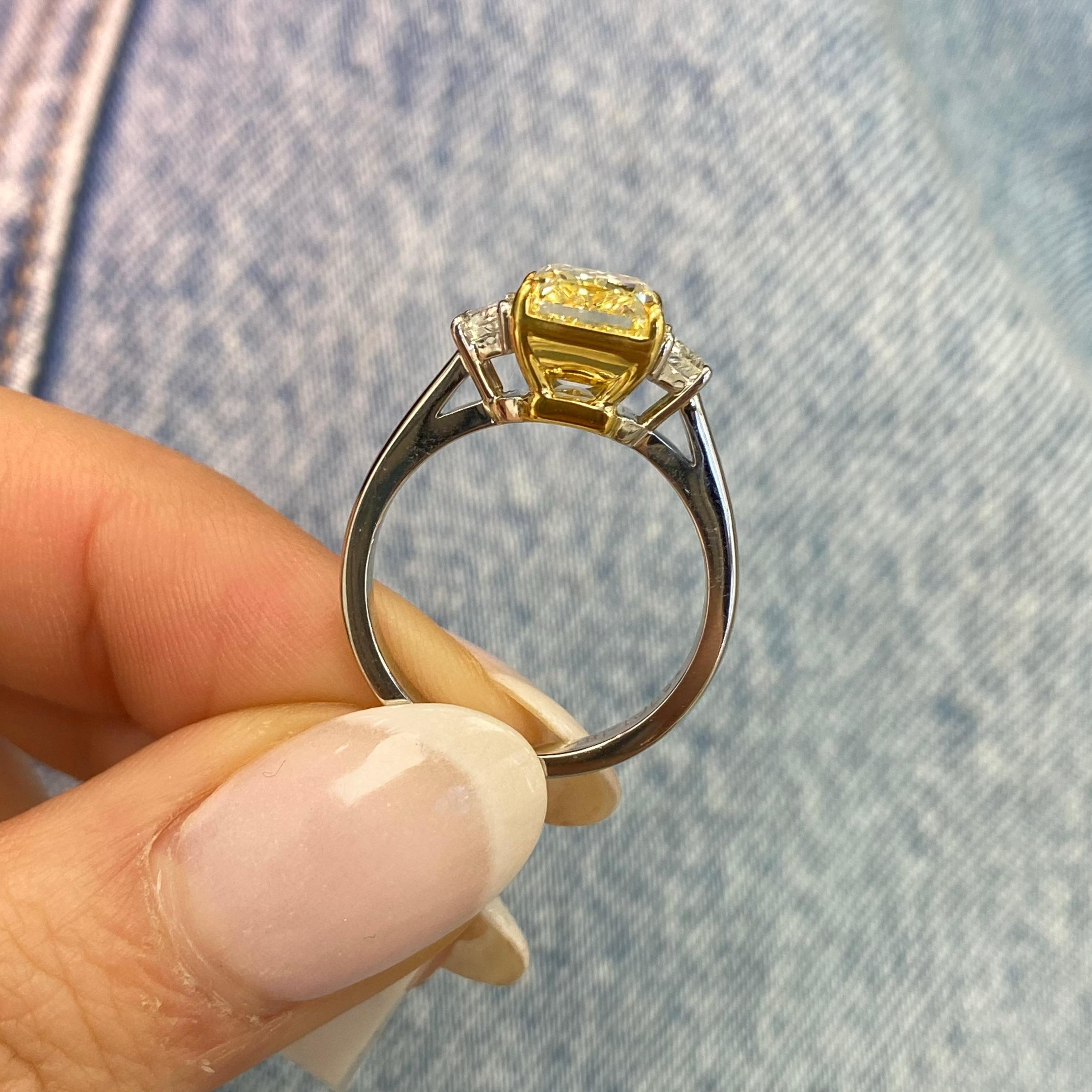 Rare Colors 3.29ct Fancy Yellow Elongated Radiant Diamond Three Stone Ring In New Condition For Sale In New York, NY