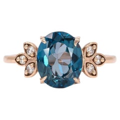 Anello con topazio blu di Londra da 3,2 carati e diamanti estratti dalla terra: oro massiccio 14K