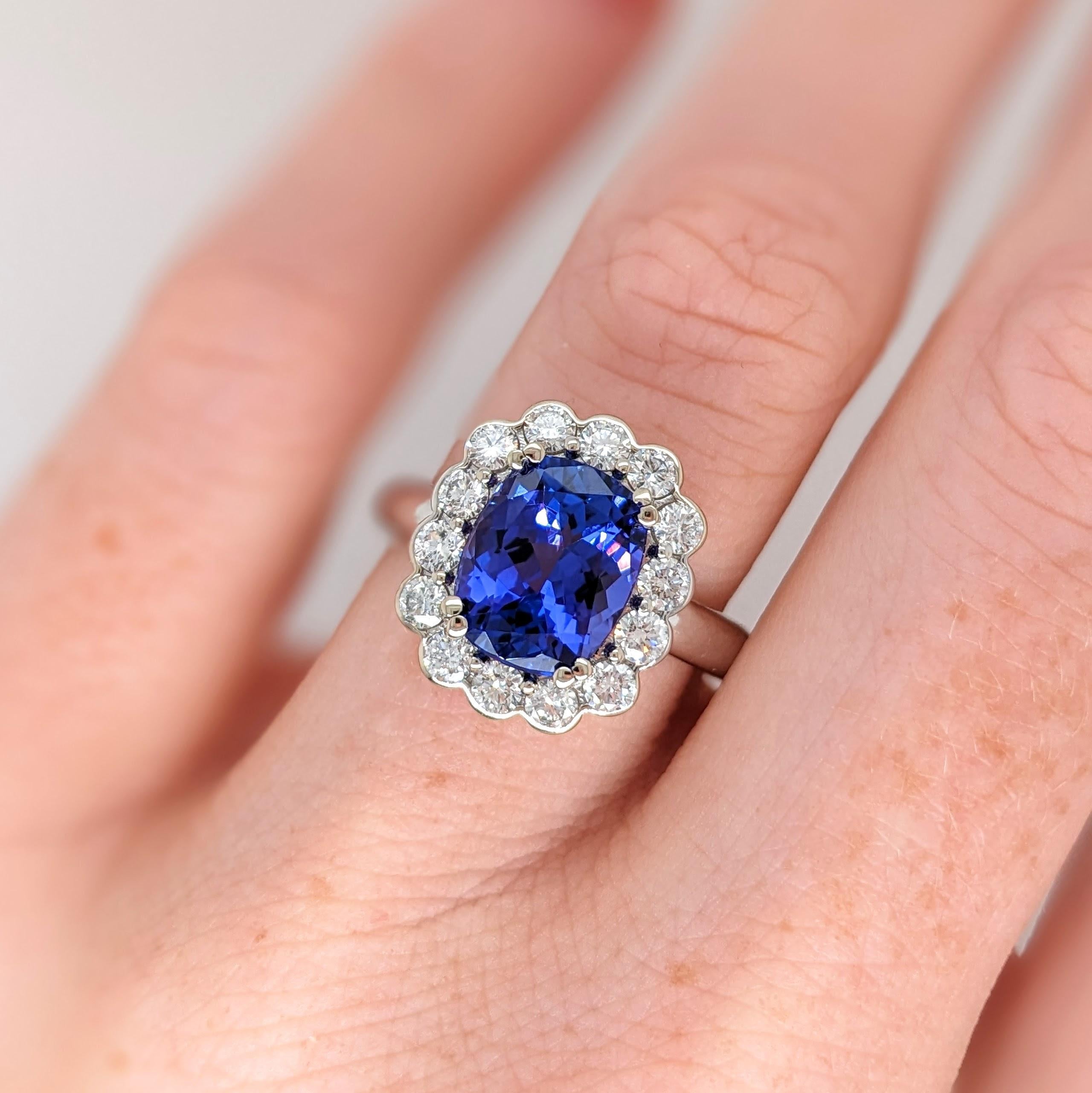 This beautiful ring features a 3.20 carat cushion cut Tanzanite gemstone with natural earth mined diamonds in solid 14K gold. This Tanzanite ring makes a lovely December birthstone gift for your loved ones! 

Specifications

Item Type: Ring
Center