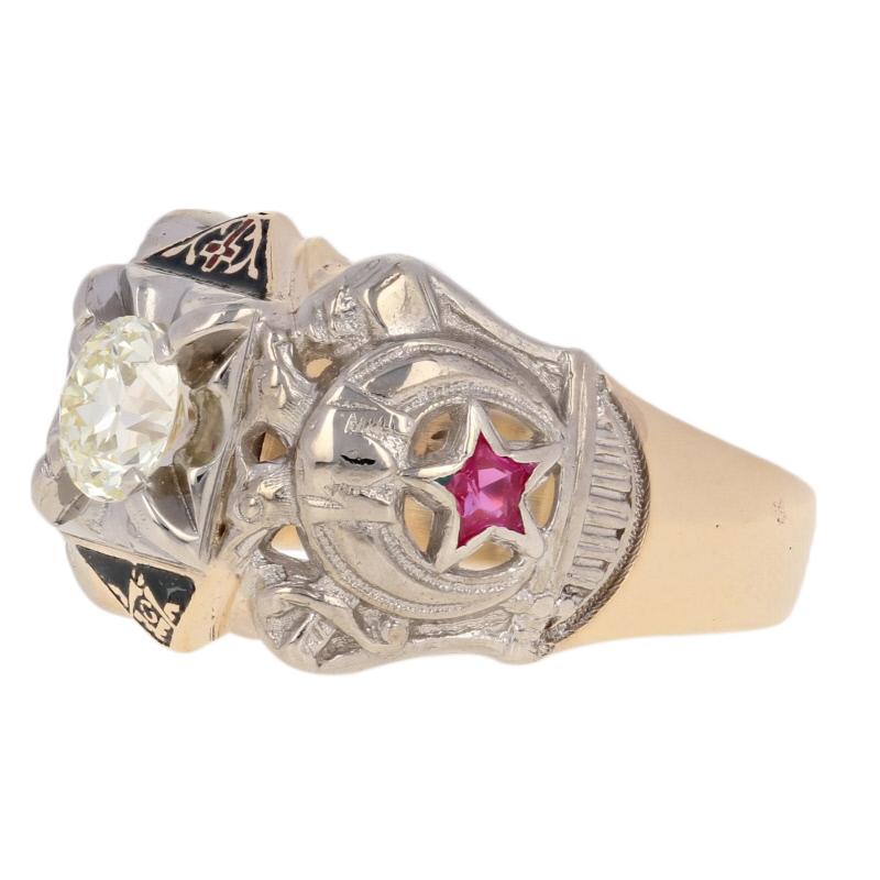 Crafted in 10k yellow and white gold, this 32nd degree Scottish Rite ring hosts a radiant diamond accompanied by two synthetic rubies and enamel work. This piece handsomely displays a double-headed eagle, a Shriners crescent and scimitar sword, a