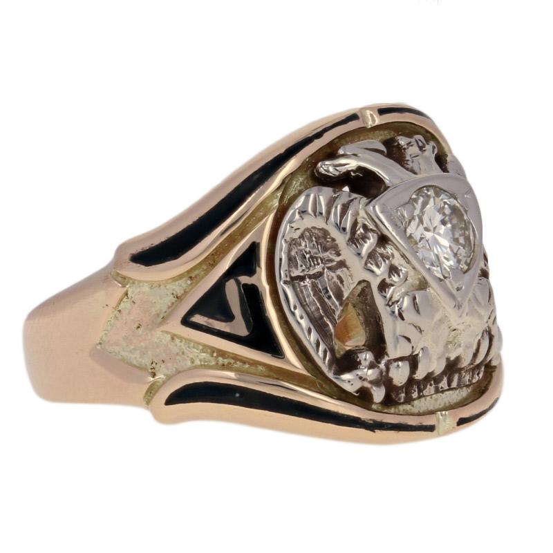 Composed of 14k yellow gold, this exceptional Scottish Rite ring showcases a 14k white gold double-headed eagle bearing a radiant diamond on its chest. The number 32 and a Yod symbol flank the majestic eagle, and rich black enamel work adds to this