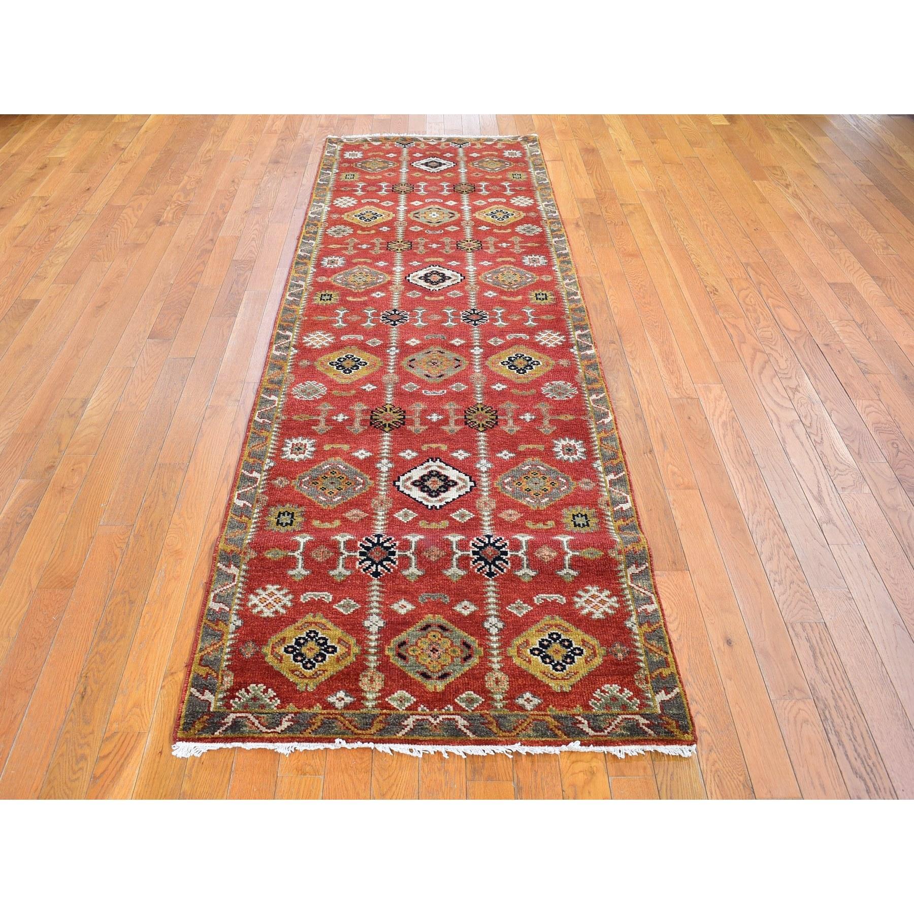 This is a truly genuine one-of-a-kind 100% Wool Repetitive Geometric All Over Design Red Hand Knotted Wide Runner Oriental Rug. It has been woven for months and months in the centuries-old Persian weaving craftsmanship techniques by expert