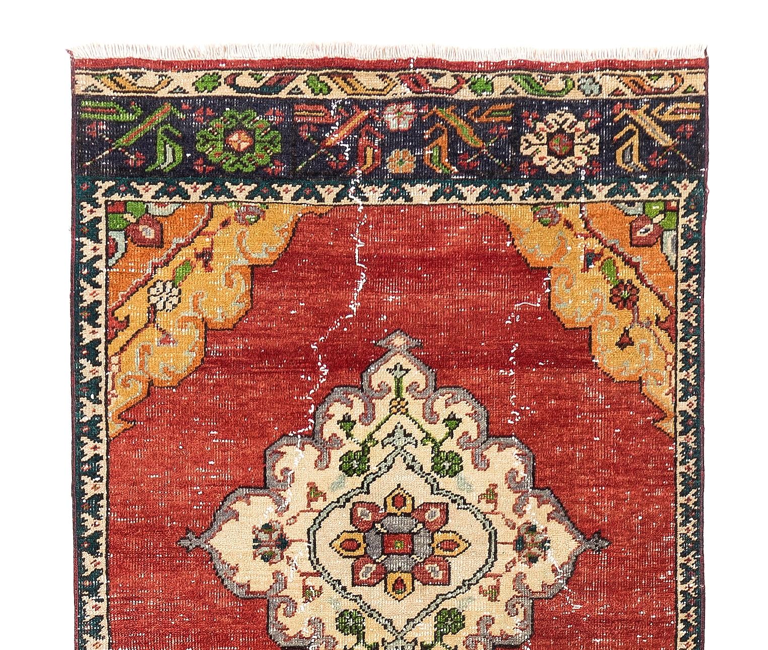A mid-20th century hand-knotted runner from Turkey in deep, rich colors softened over time with wool pile on wool foundation. Good condition, minor wear consistent with age, sturdy and as clean as a brand new rug. 3.2x12 Ft.