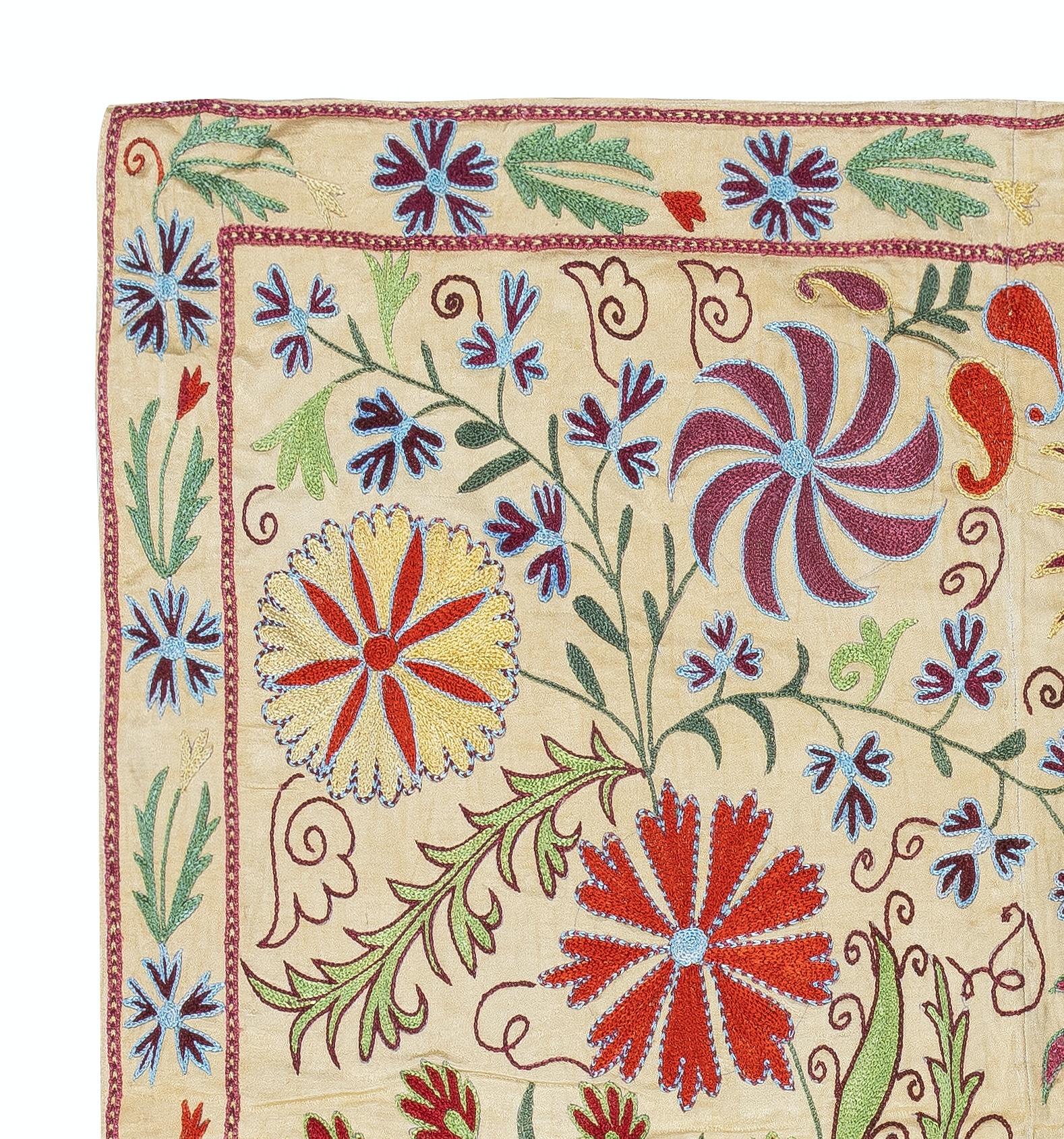Introducing our exquisite new suzani hand embroidered wall hanging, a captivating piece that combines ancient craftsmanship with modern artistry. This embroidered cloth is not just a suzani throw, but a remarkable suzani wall hanging that will