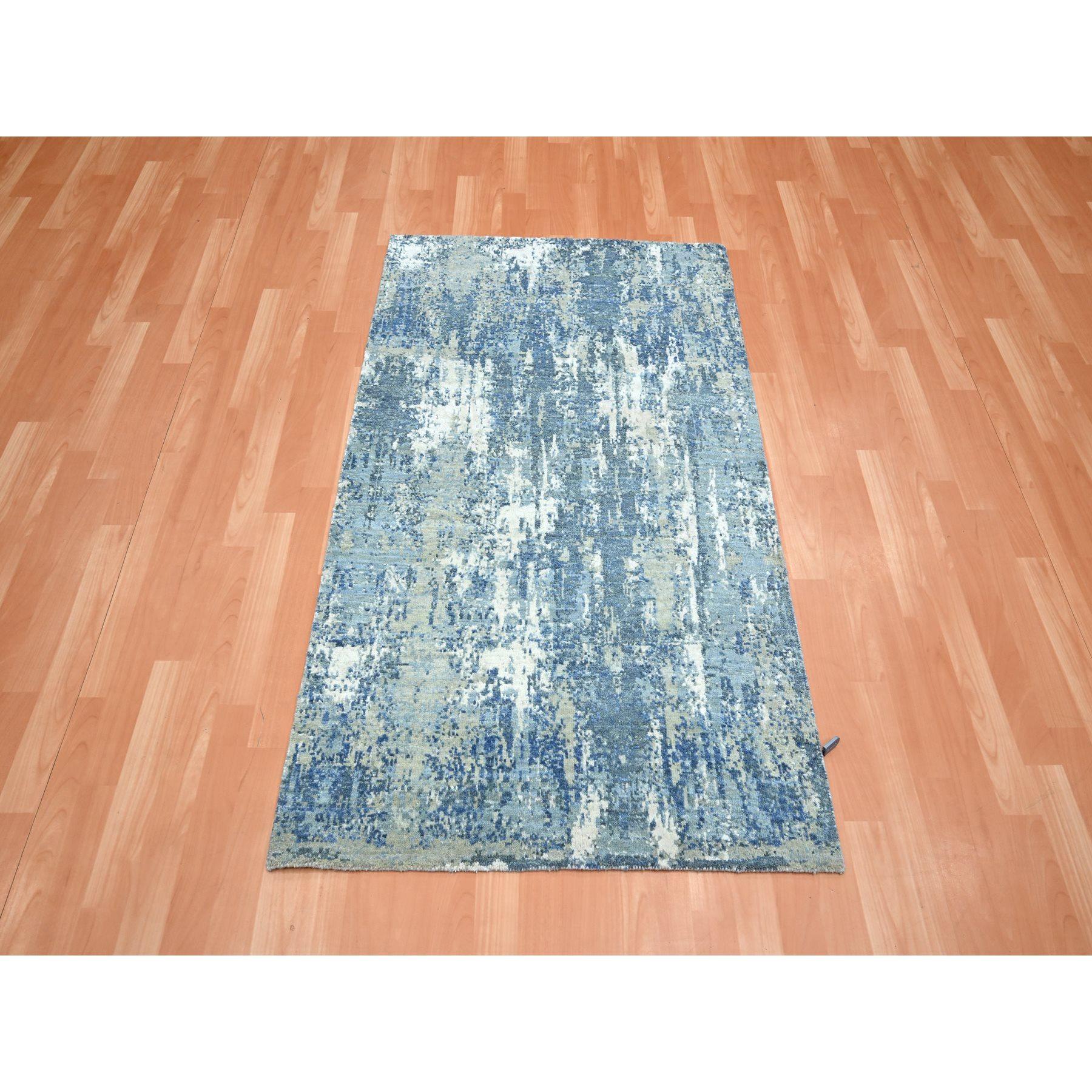 Powder Blue, Wool and Real Silk, Abstract Design, Denser Weave, Hi-Low Pile, Hand Knotted, Oriental Rug
Primary materials: Wool & Silk
Latex: No Pile 
height: 0.25 Inches
Style: Contemporary
Primary color: Blue
Secondary colors: Ivory, Teal,