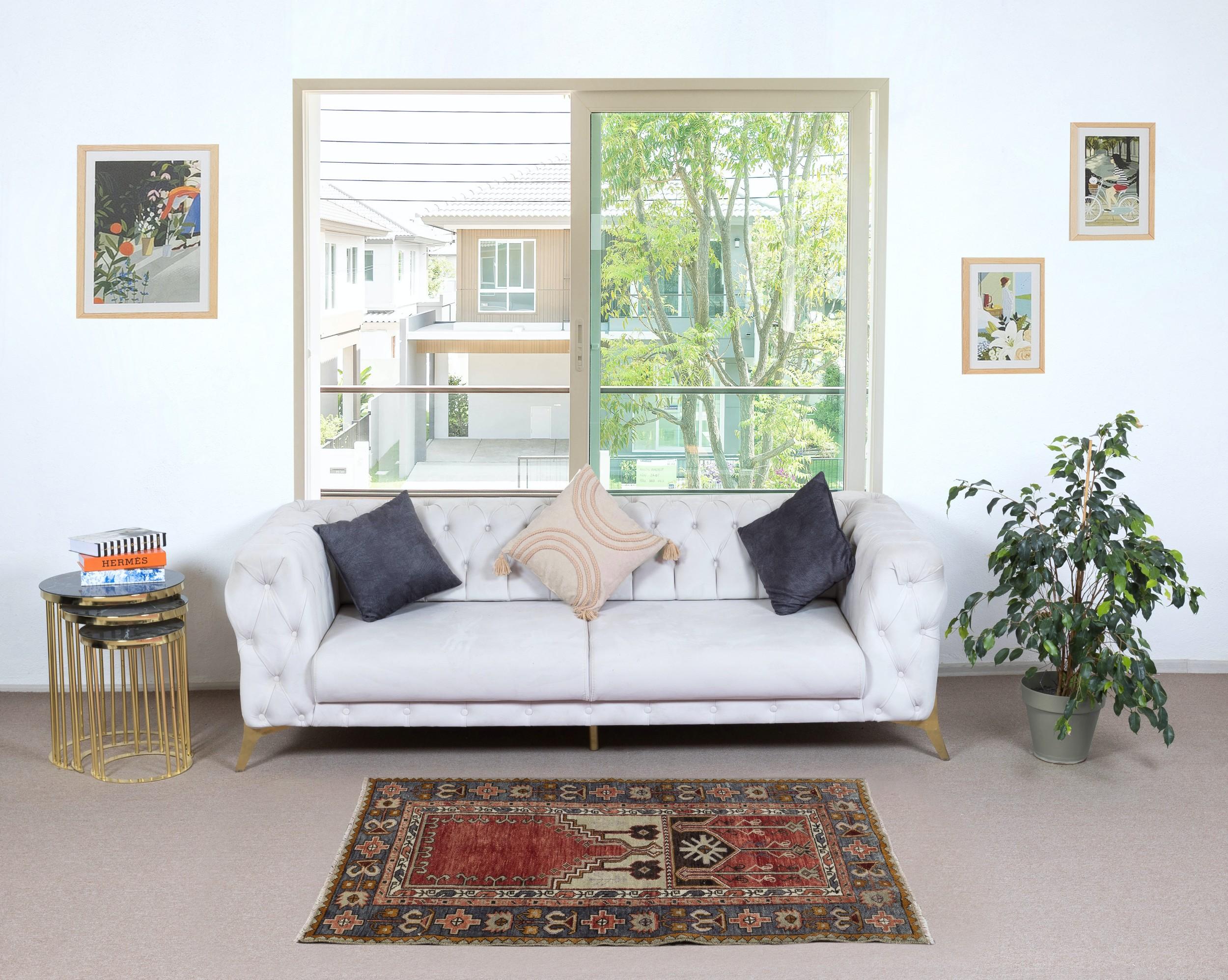 Experience the beauty of tradition with this vintage handmade Turkish Konya prayer rug, expertly crafted from 100% wool. A symbol of devotion and artistry, this rug features an elegant mihrab (prayer niche) design, reflecting the rich spiritual and