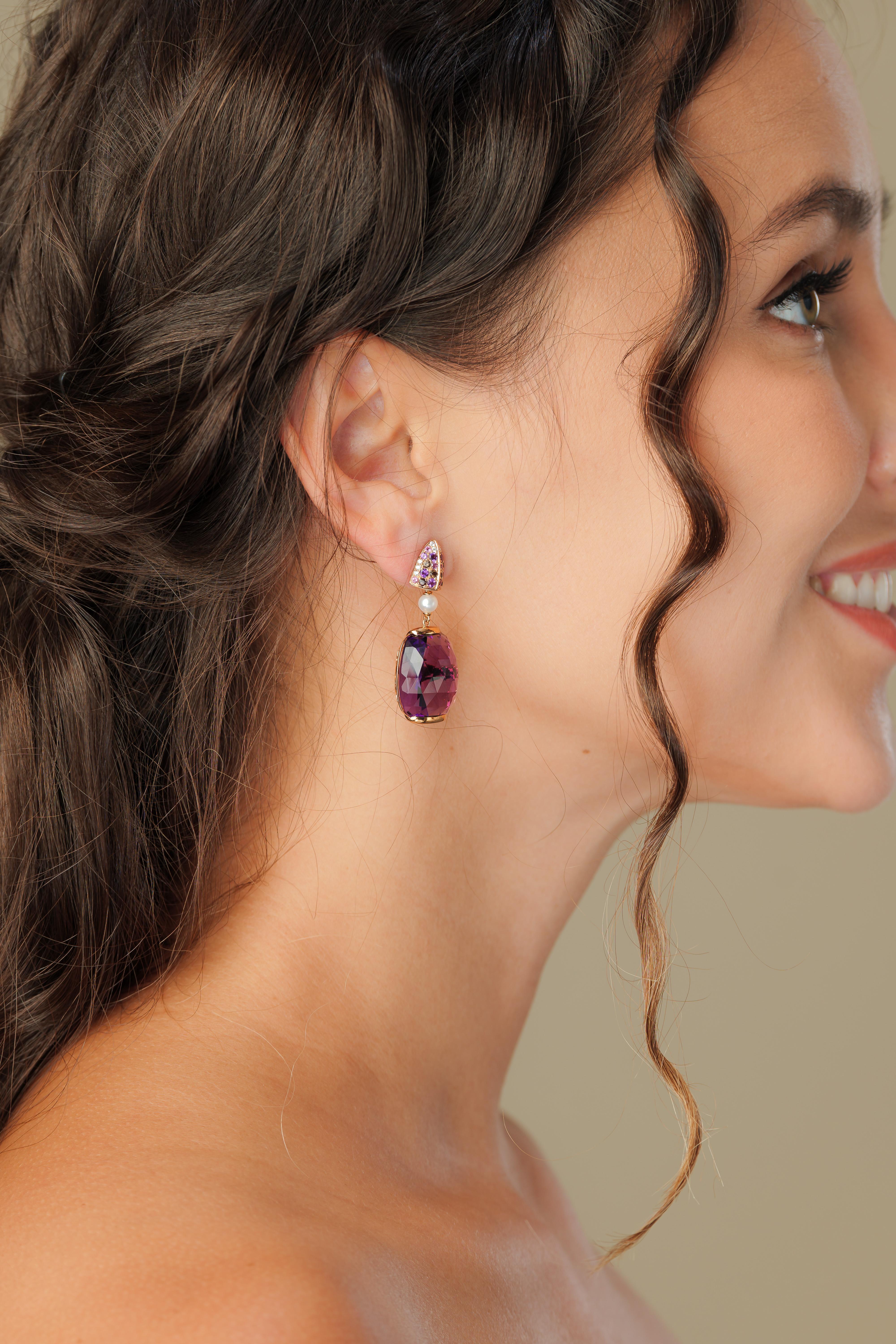 This is an bold and alluring amethyst in a fancy cut to accentuate the beauty of the gemstones. The pop of color with a trendy design makes these an eye-catching pair of earrings. 

Designer Amethyst Earrings with Gemstones, Pearl & Diamond in 18