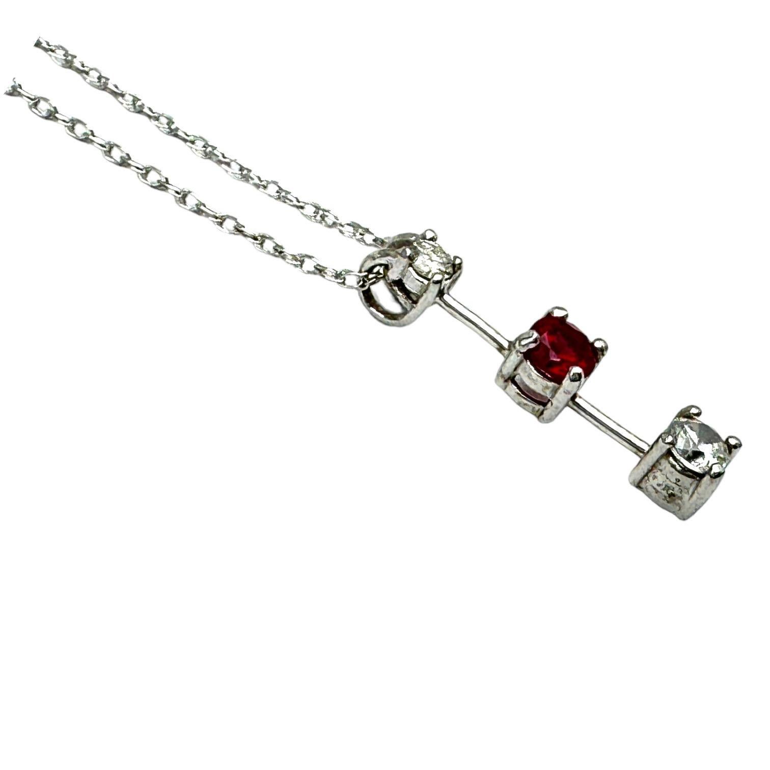 This beautiful pendant features three genuine stones: a .53 carat ruby and two diamonds. Crafted in 14 karat white gold, this stunning pendant is a classic representation of beauty and style. Perfect for any occasion, this pendant is sure to make a