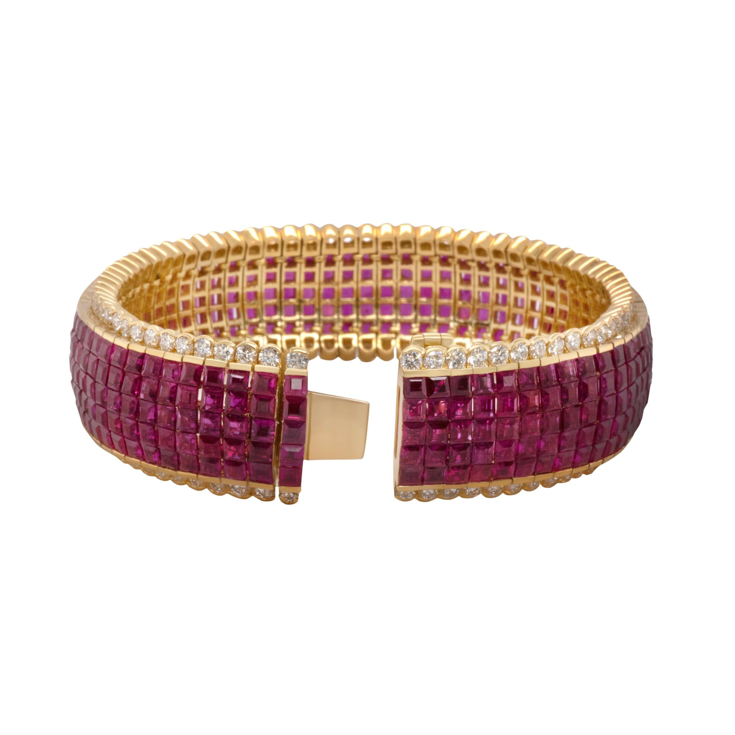 A classic yellow gold invisible set ruby and diamond bracelet.  This piece houses an impressive 370 pieces of natural square cut rubies in five rows of invisible setting surrounded by 148 bezel set round white diamonds. 

Ruby 370 pcs.
Size 2.5